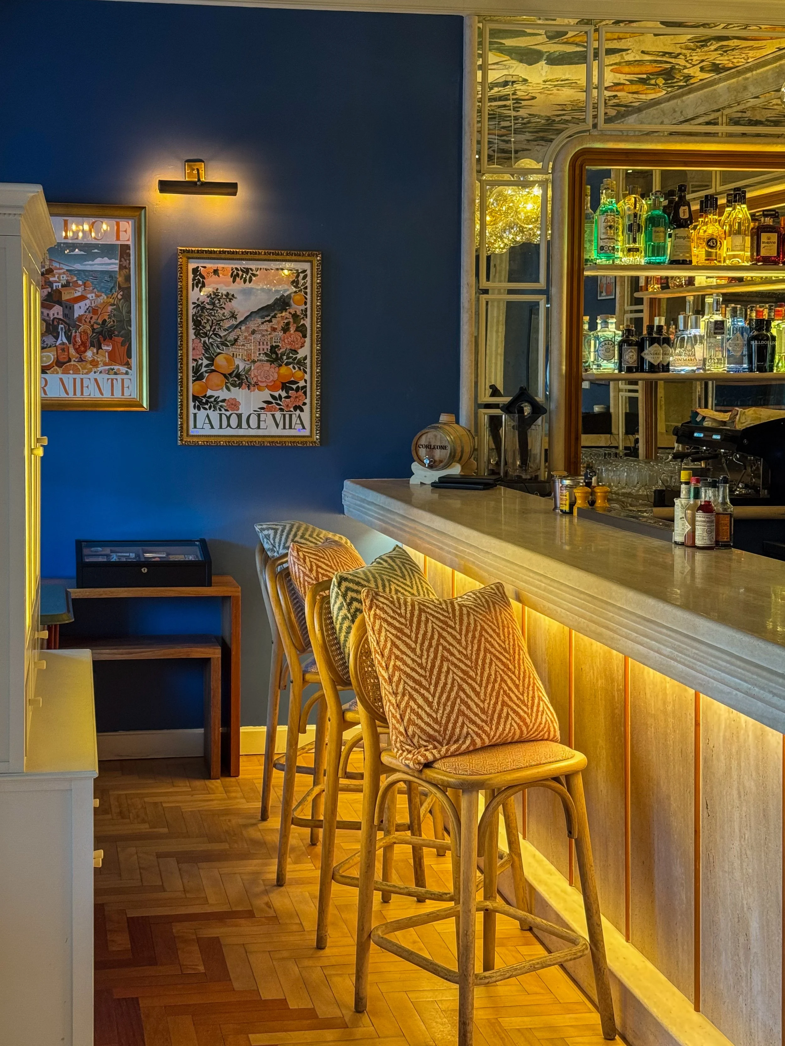 Stylish cocktail bar blending contemporary elegance with warm lighting and premium spirits