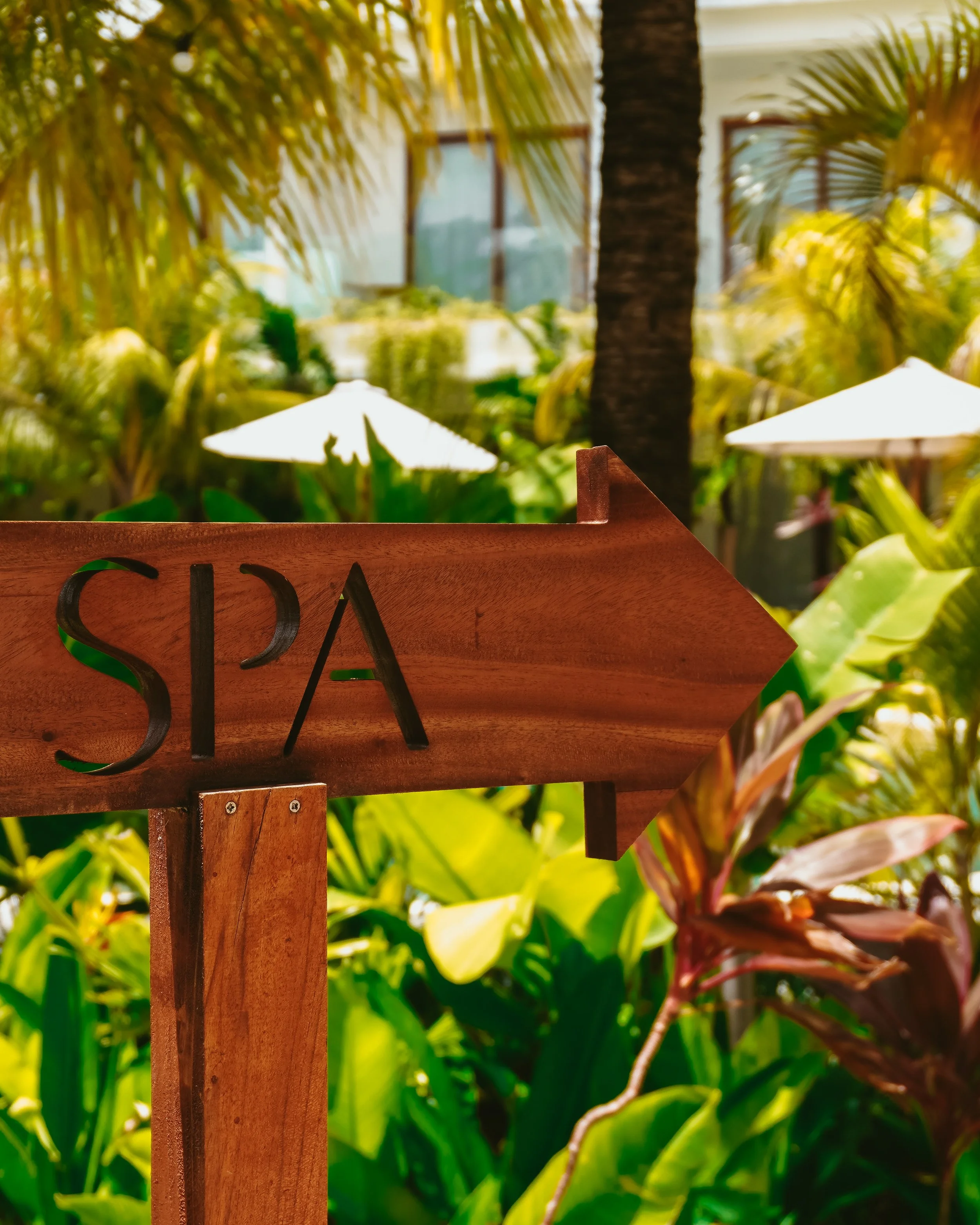 Sunlit pathways and tropical gardens guiding you through a stay defined by calm and simplicity, Uryah Hotel Lombok – Lombok, Indonesia.