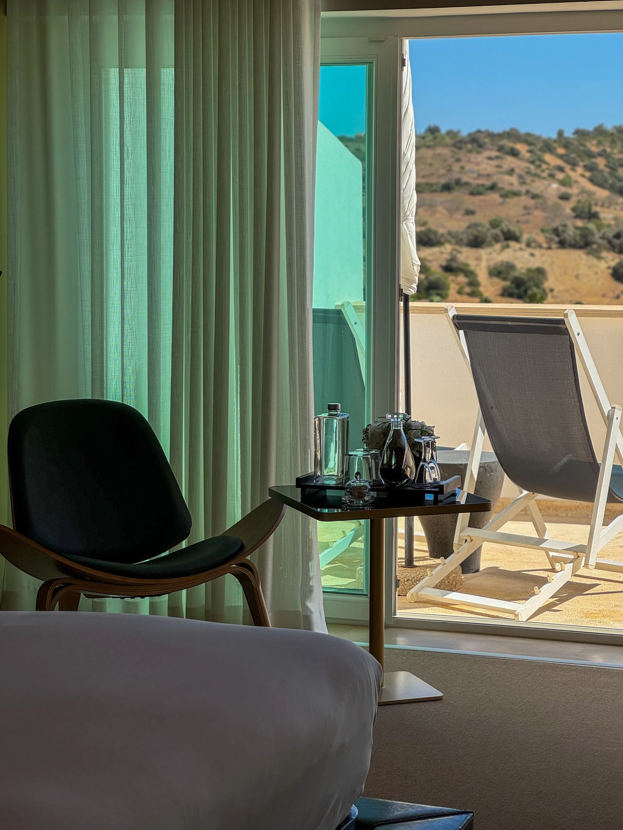 Elegant guest room with private terrace overlooking the Algarve countryside at Vila Valverde