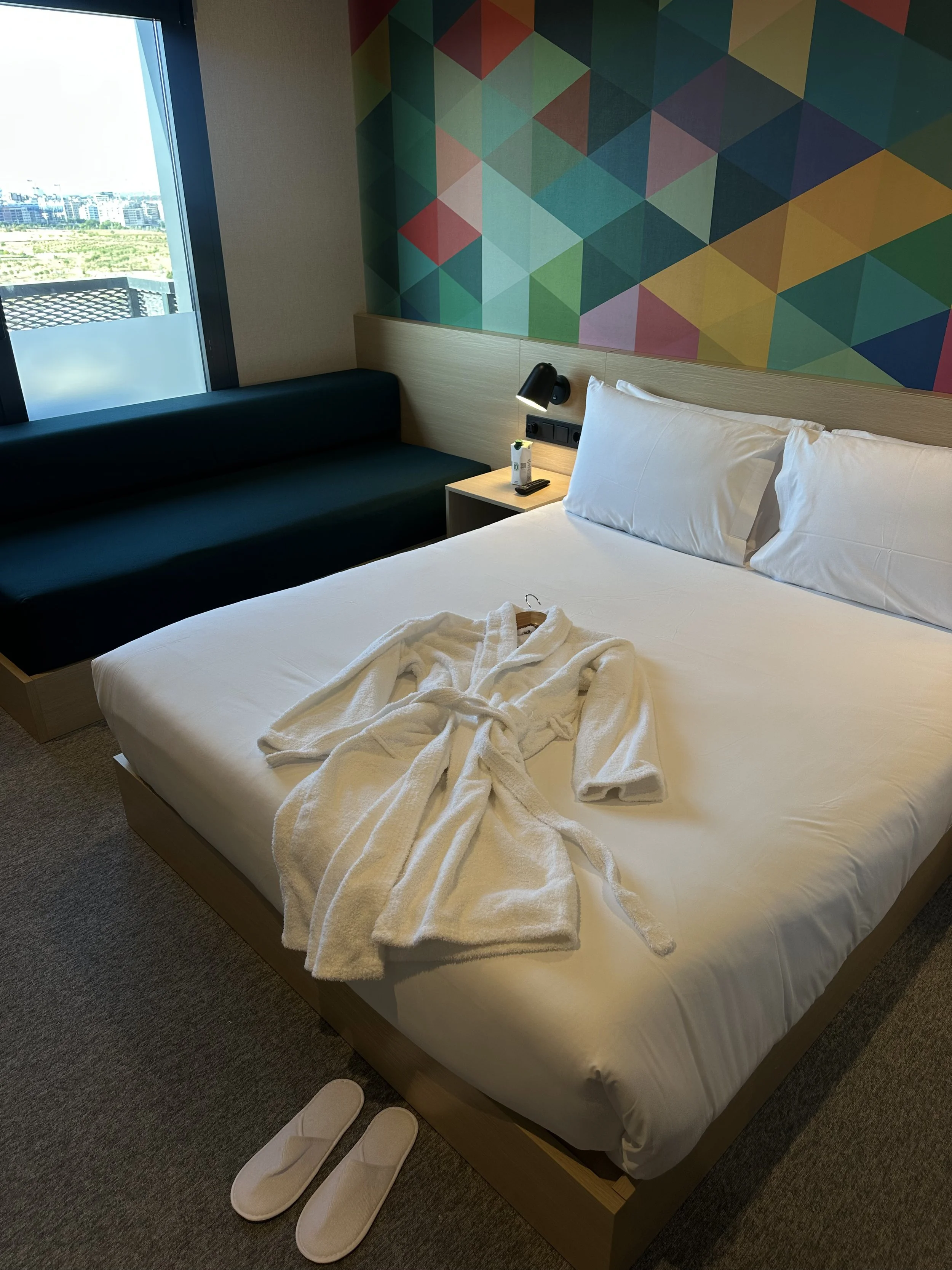 Comfortable king room with modern décor, city views, and thoughtful amenities