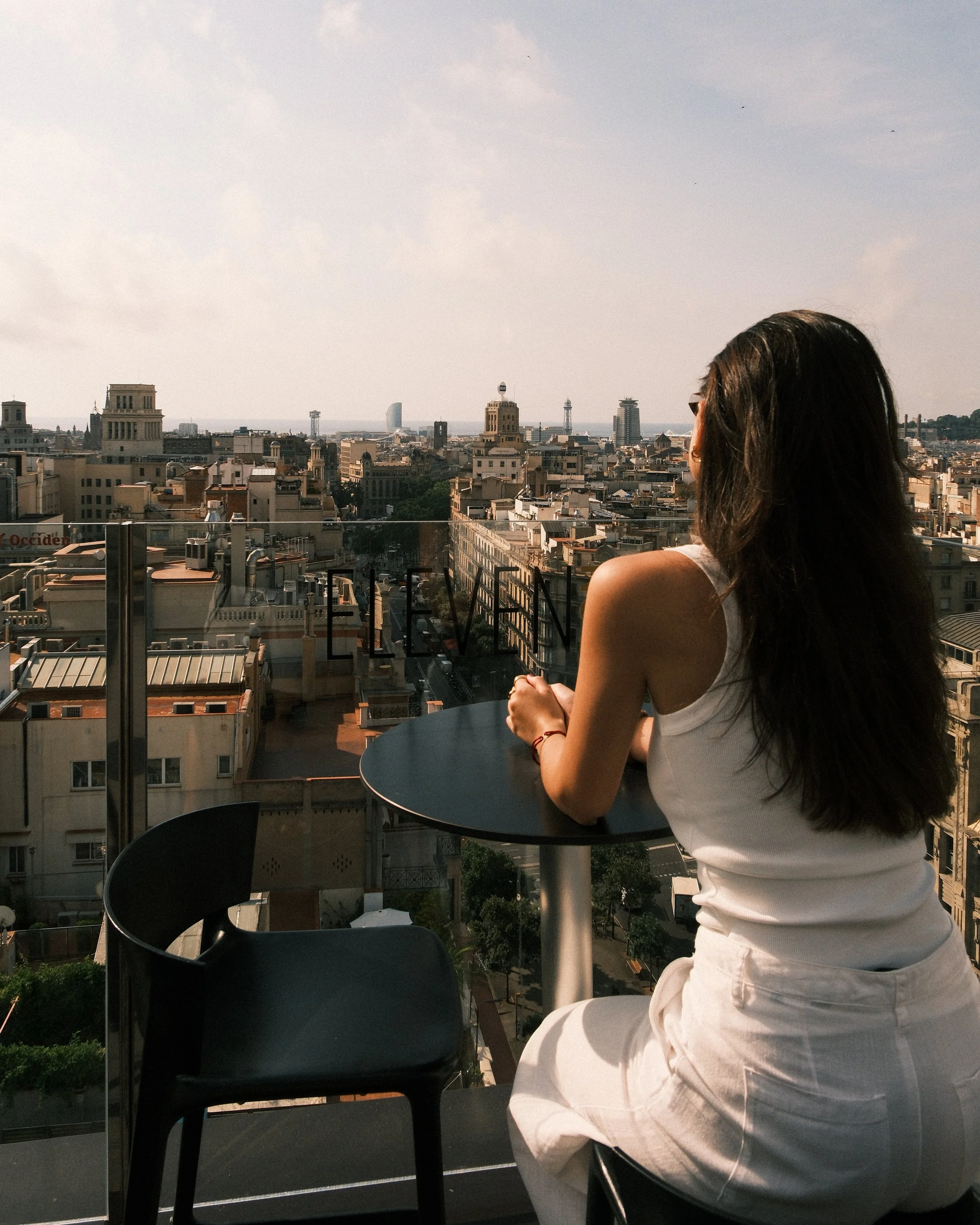 Guest enjoying panoramic rooftop views over Barcelona at NH Collection Gran Hotel Calderón
