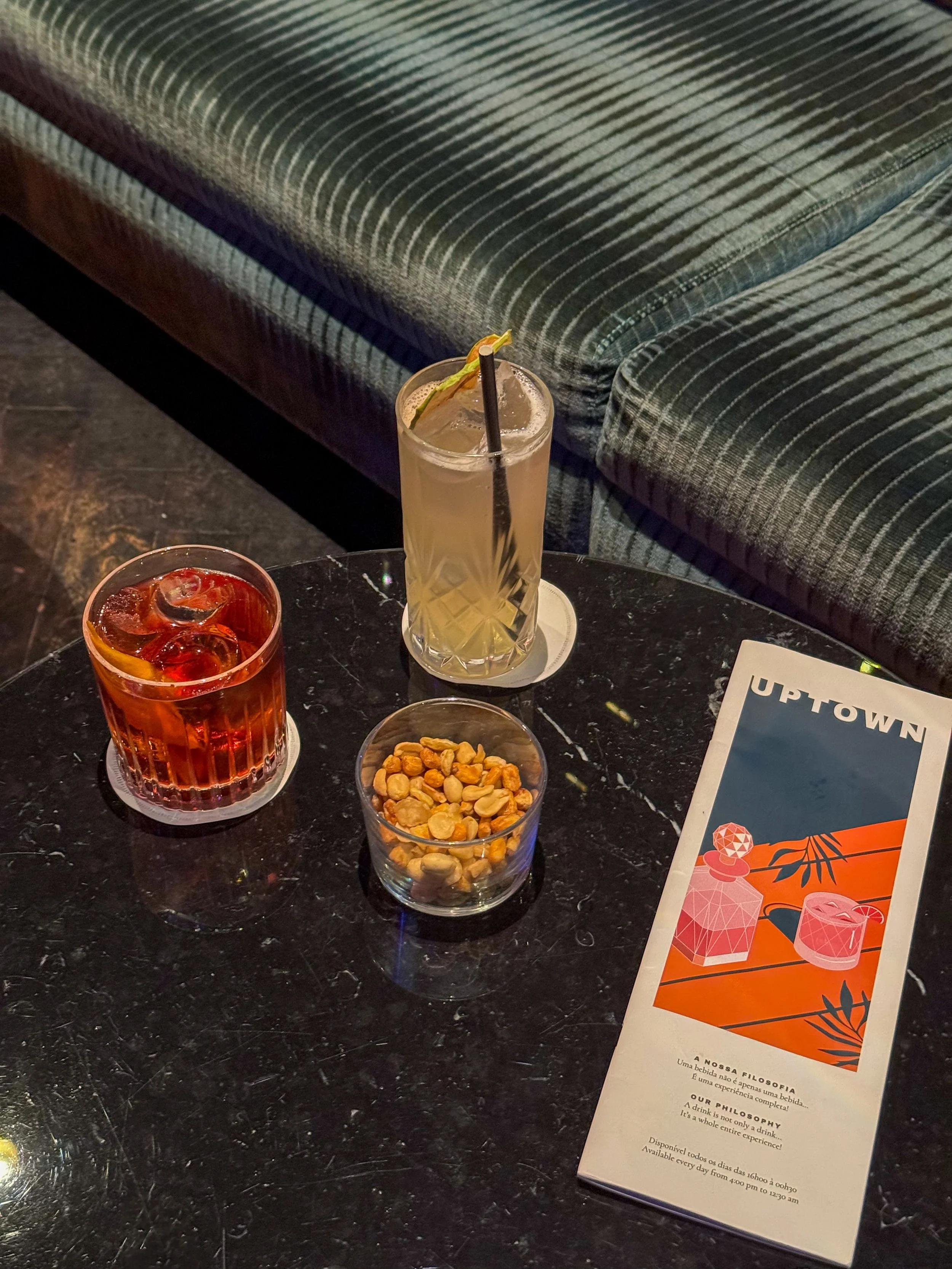 Signature cocktails served at Uptown Bar in a refined luxury lounge setting