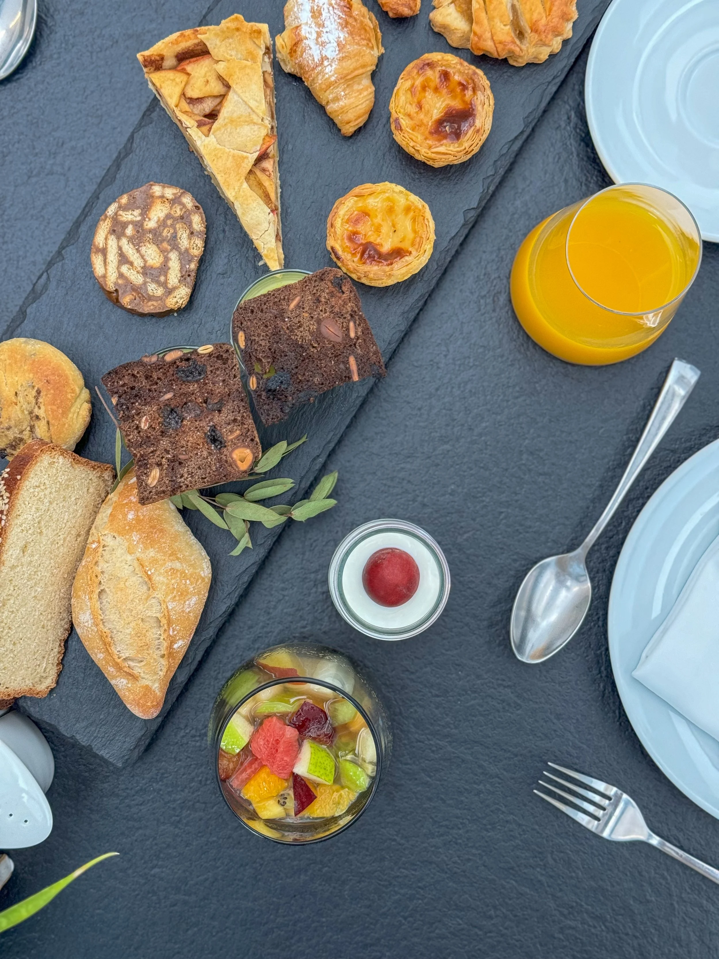Breakfast selection featuring fresh pastries, fruit, and Portuguese specialties at Vila Valverde