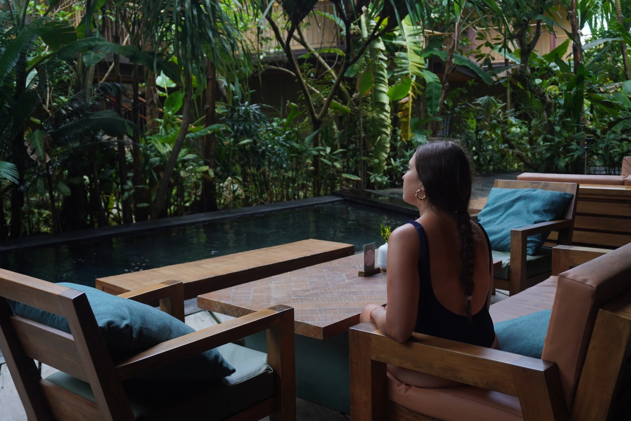Peaceful outdoor lounge overlooking the hotel's tropical pool