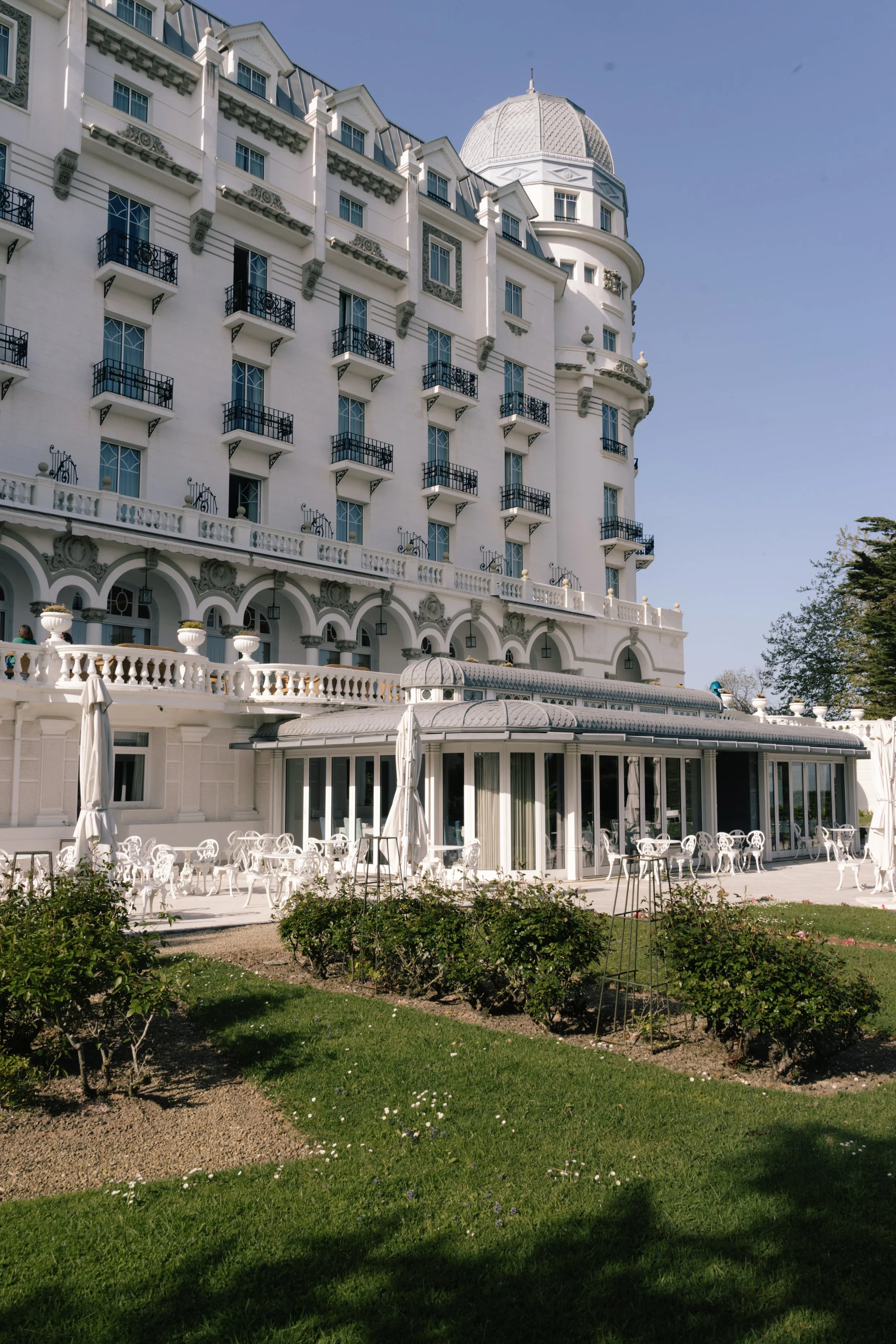 Historic grand hotel façade with classic European architecture and garden setting at Eurostars Hotel Real, Santander