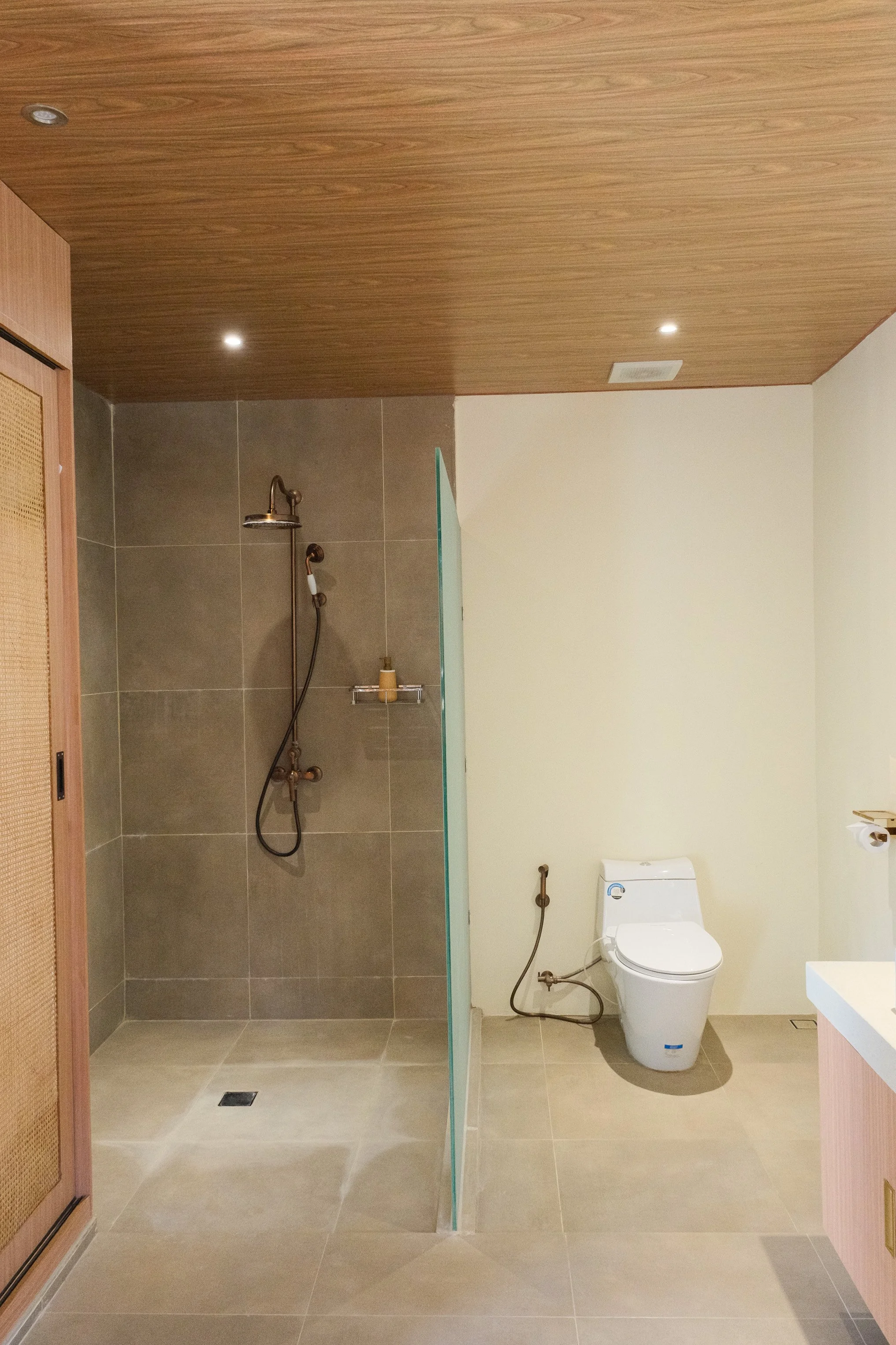 Fitness room equipped with cardio Contemporary bathroom with walk in rainfall shower and minimalist design and free weights
