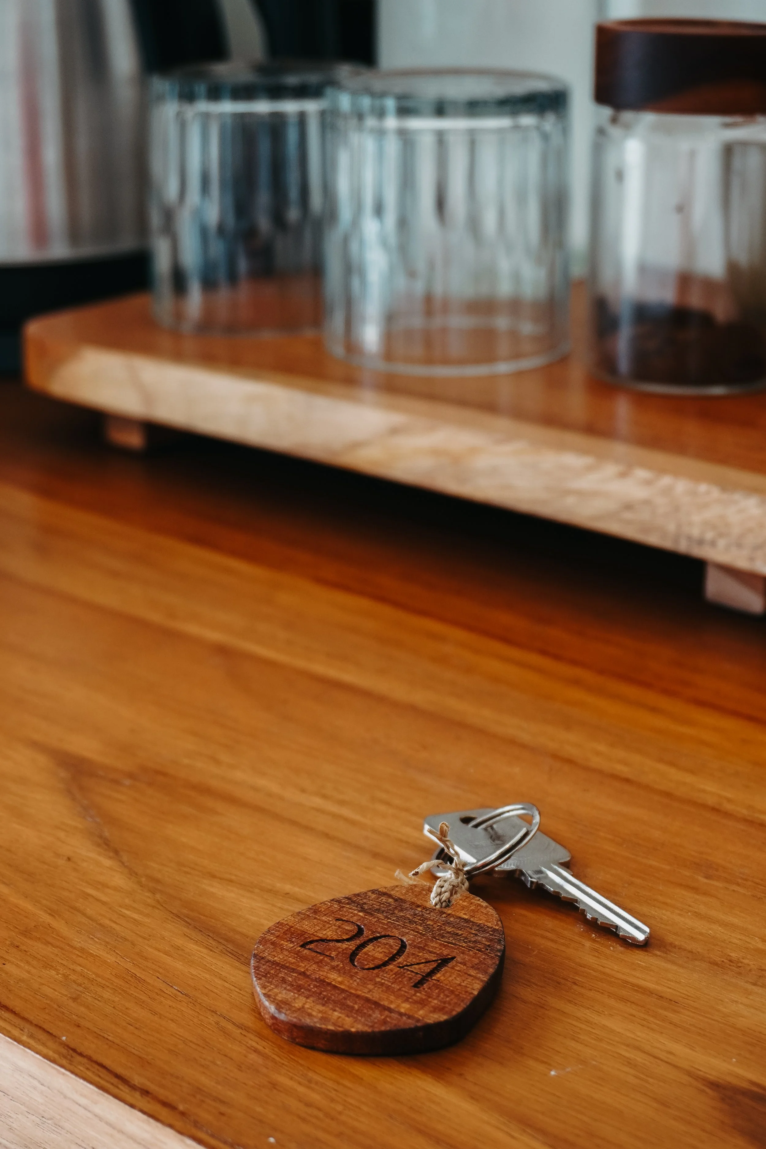 A simple arrival, marked by warm wood tones and quiet design, setting the tone for the stay ahead, Uryah Hotel Lombok – Lombok, Indonesia.