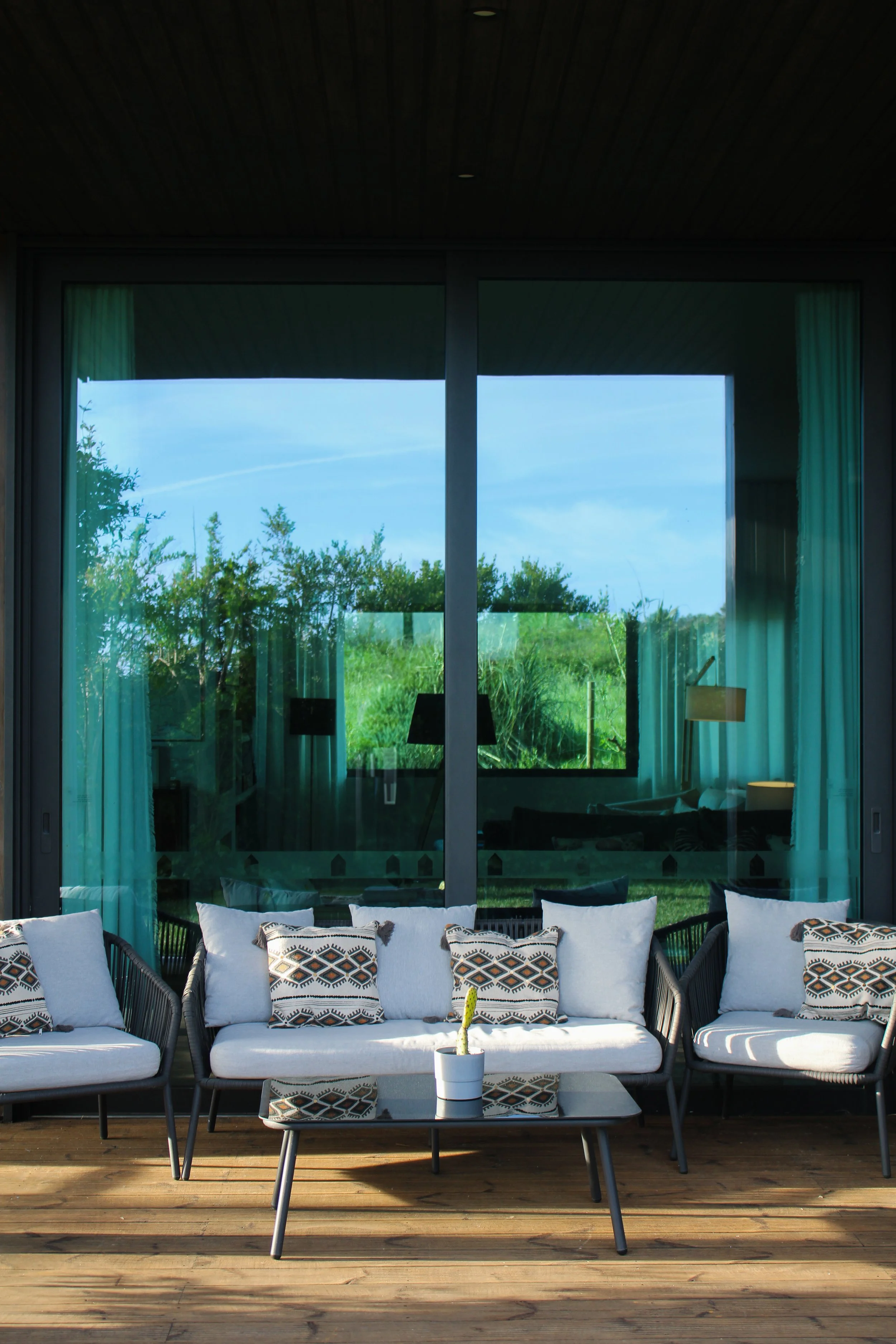 Terrace seating area with soft cushions overlooking nature at Dream Guincho in Guincho