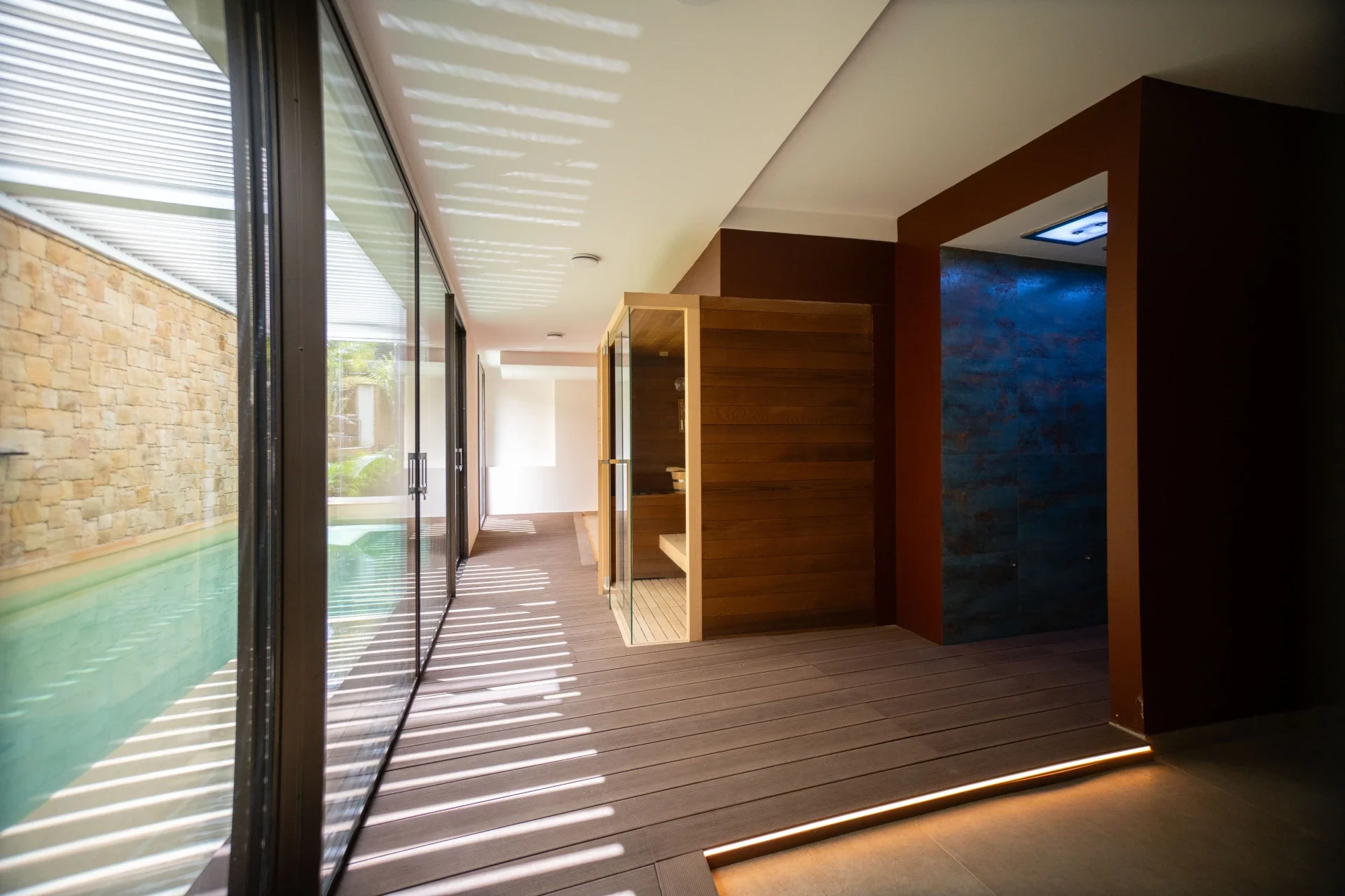 Sauna and wellness corridor with natural light at Sunset Hotel Cefalù