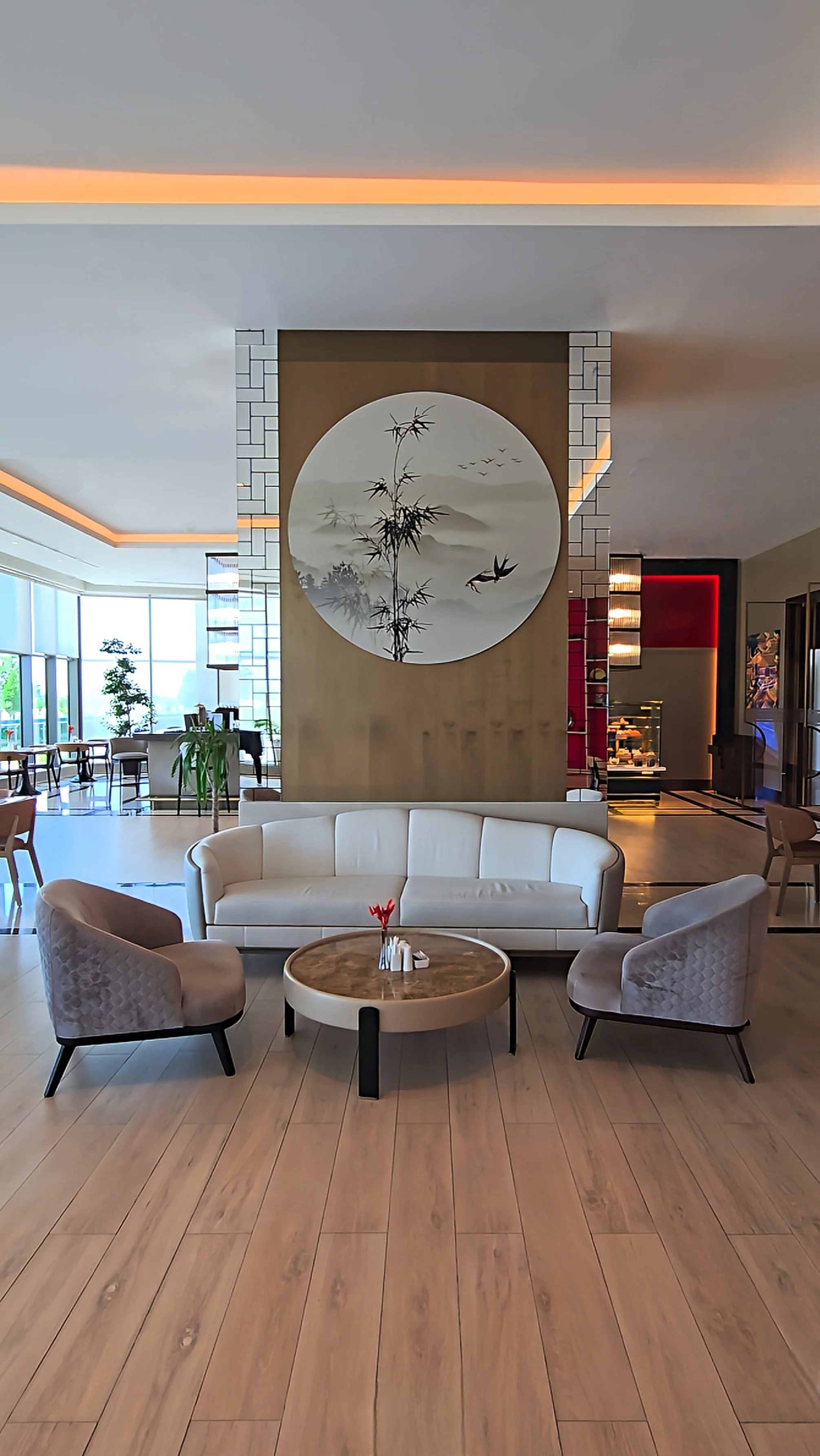 Stylish lobby lounge with contemporary seating, Asian-inspired artwork and welcoming social spaces at Silk Road by Minyoun Hotel