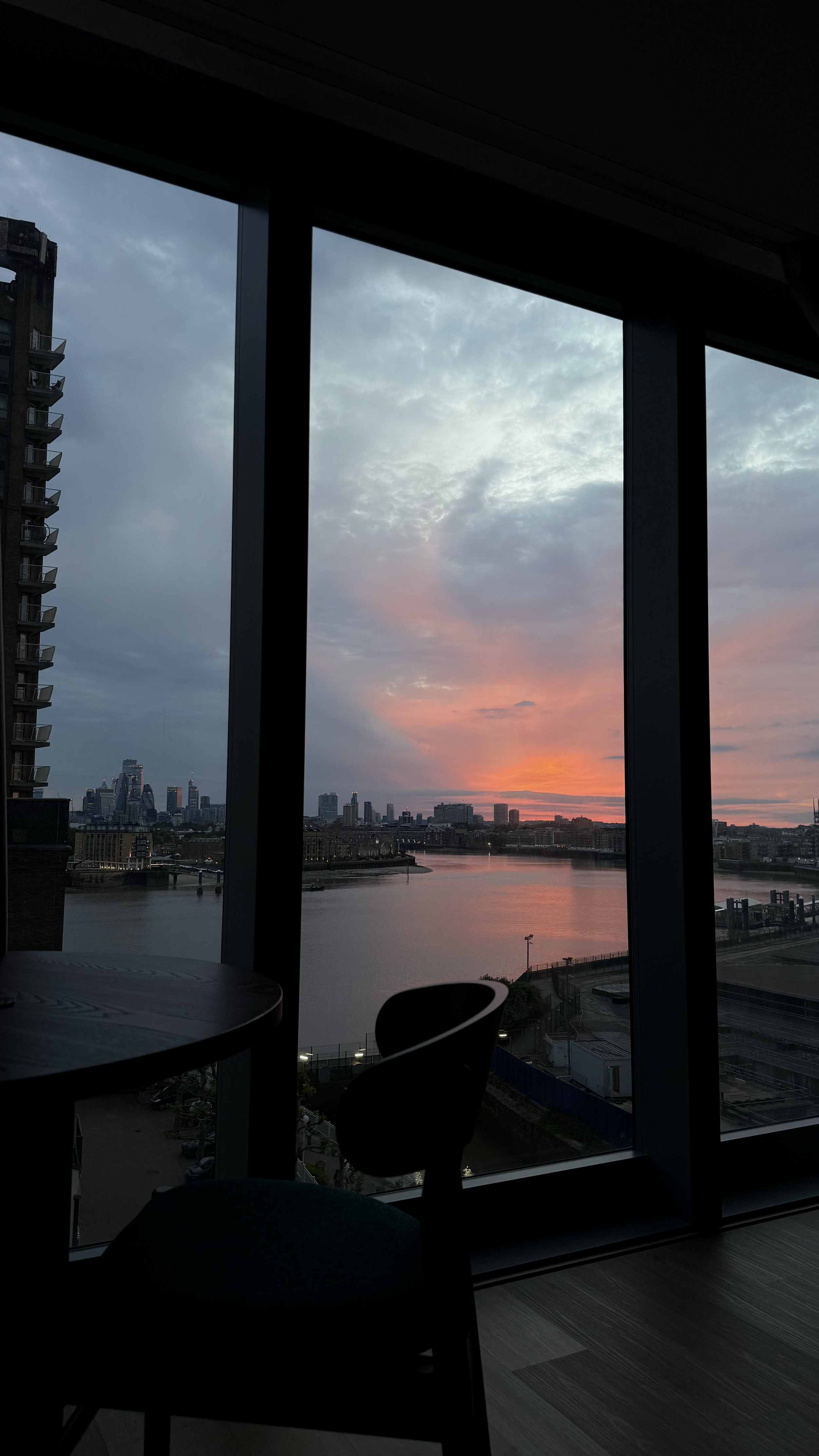 Sunset views across the River Thames from a panoramic apartment window