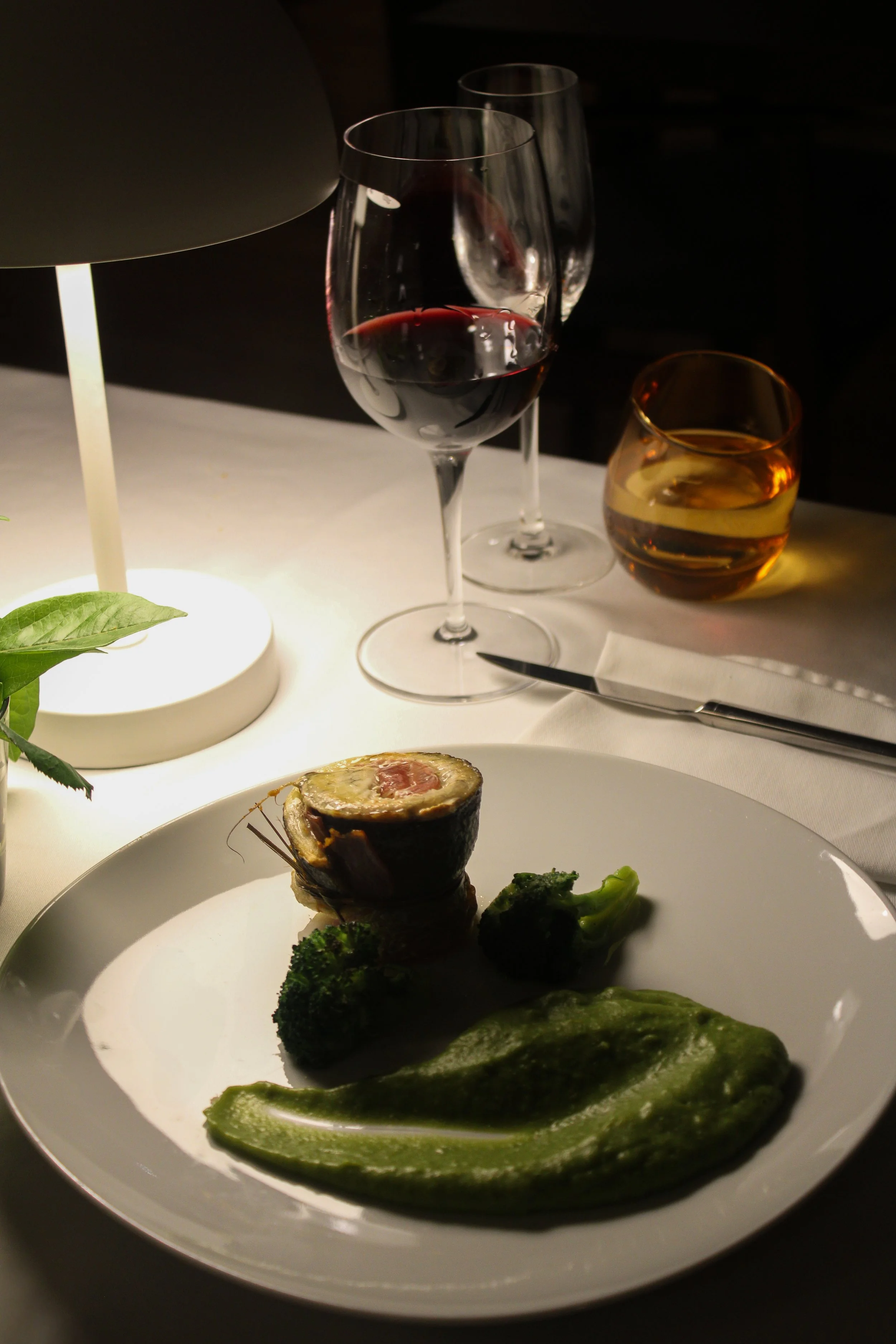 Refined dining experience with plated gourmet dish and wine at Casas da Lapa in Serra da Estrela, Portugal