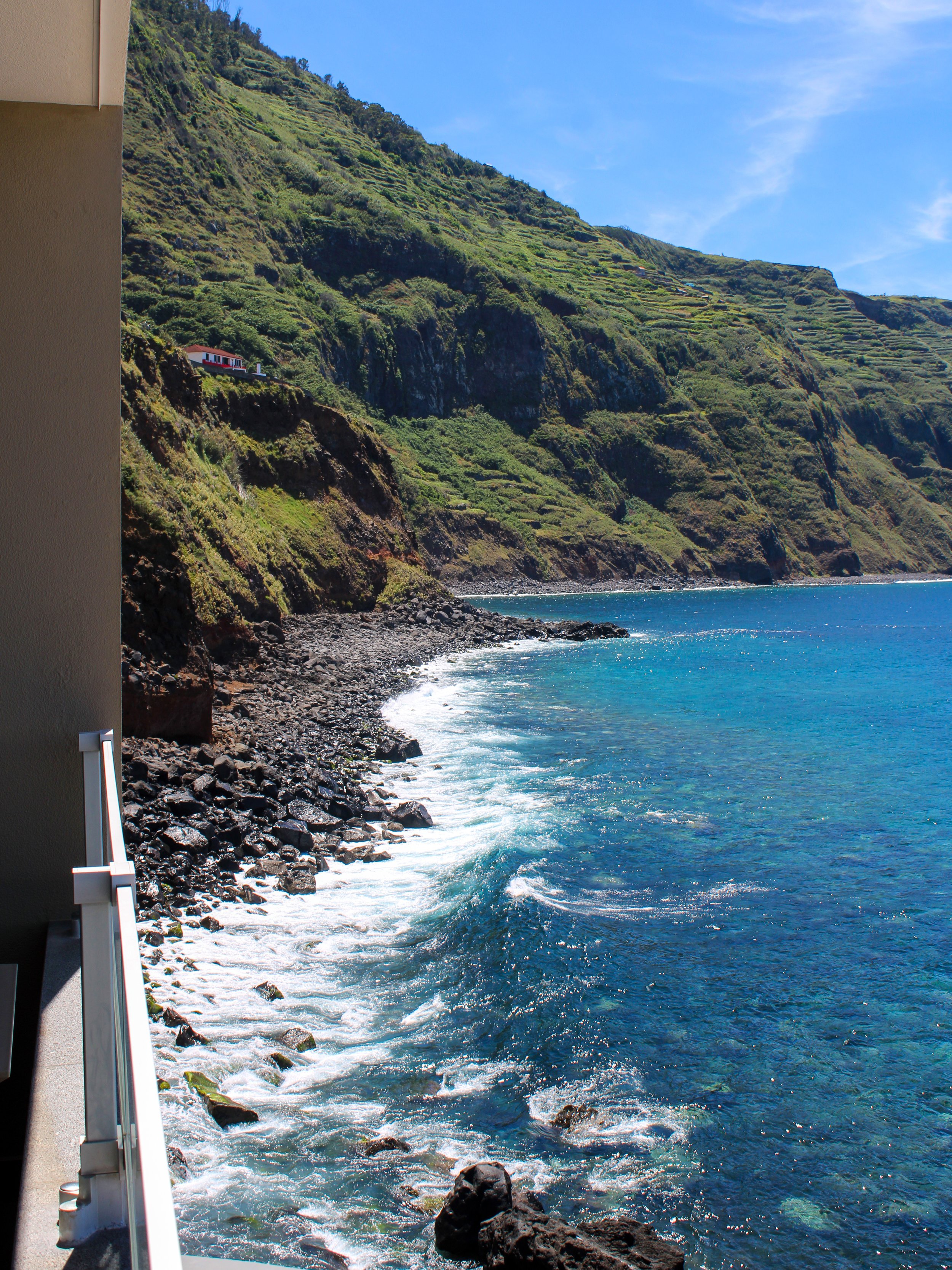 Spectacular Atlantic coastline viewed from a private balcony overlooking Madeira’s volcanic shoreline