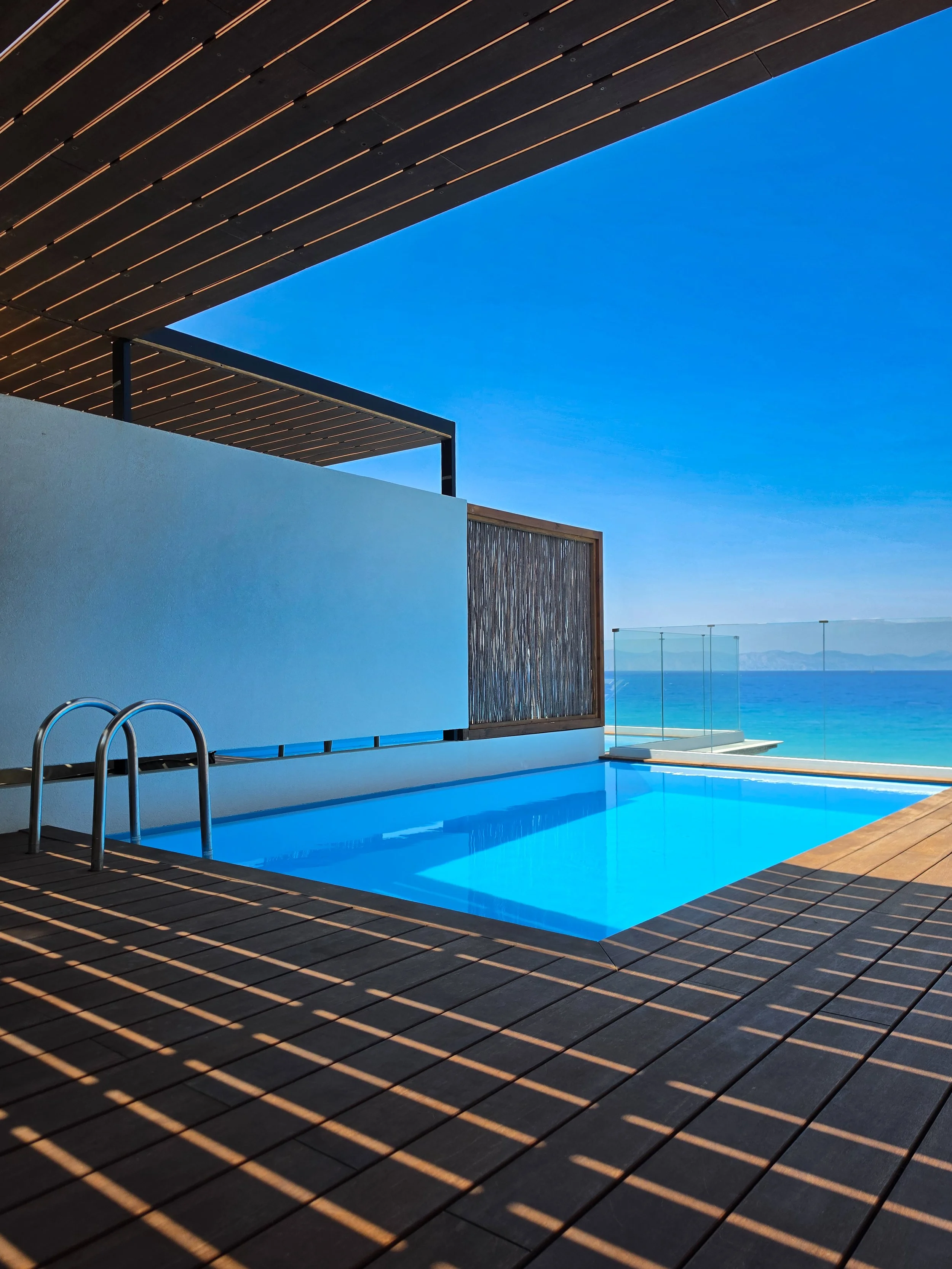 Private rooftop pool overlooking the Aegean Sea from a luxury suite in Rhodes, Greece