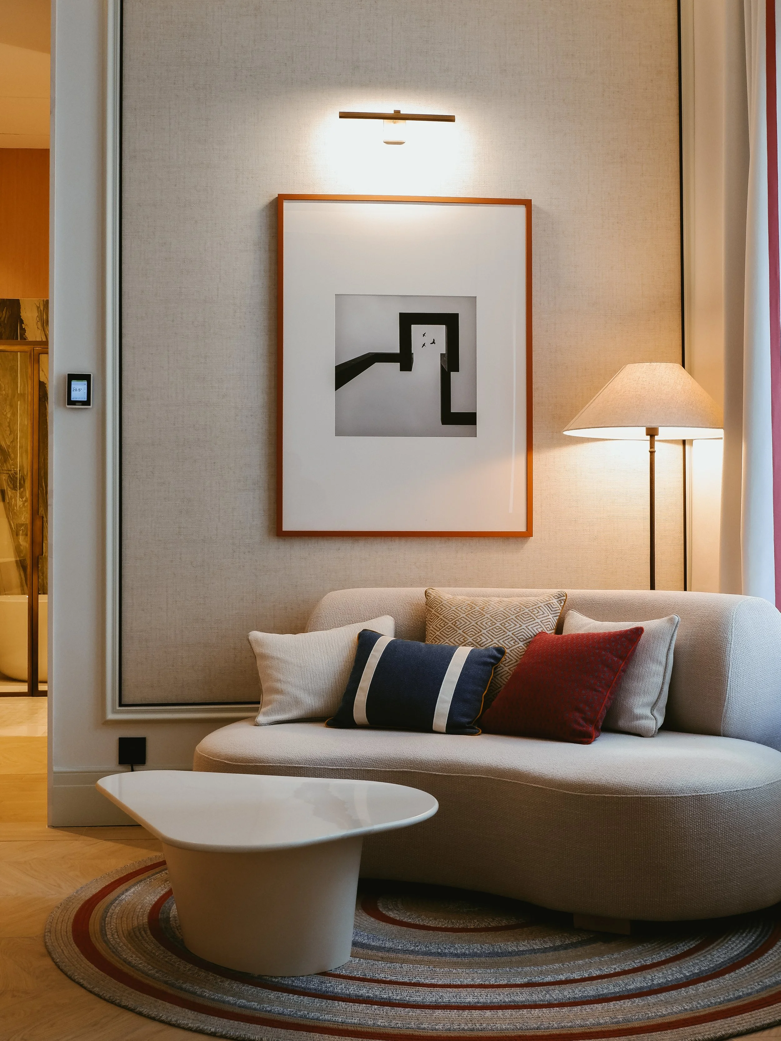 Elegant living area with designer furnishings and contemporary artwork