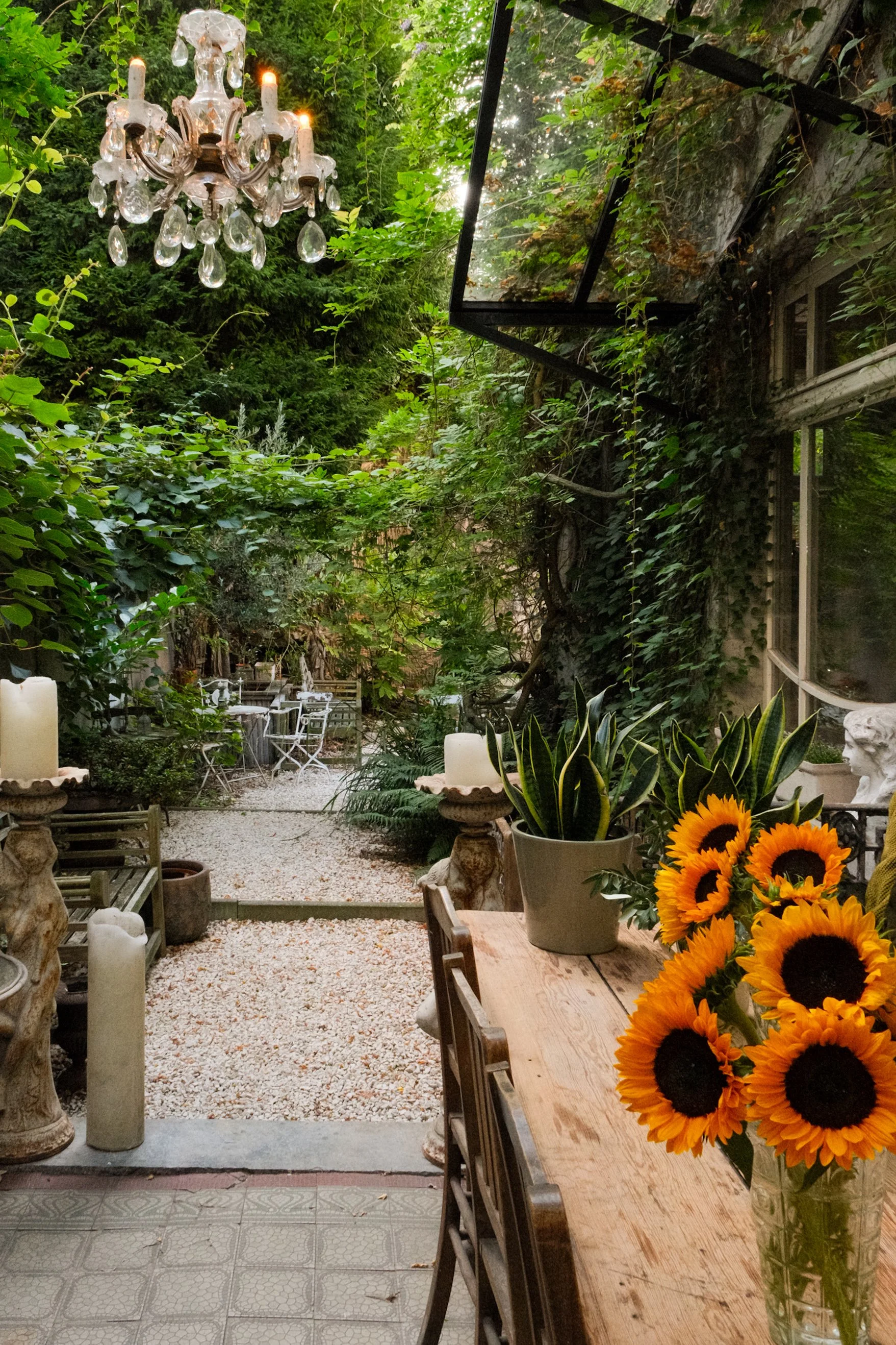 Lush garden terrace surrounded by greenery and elegant outdoor seating