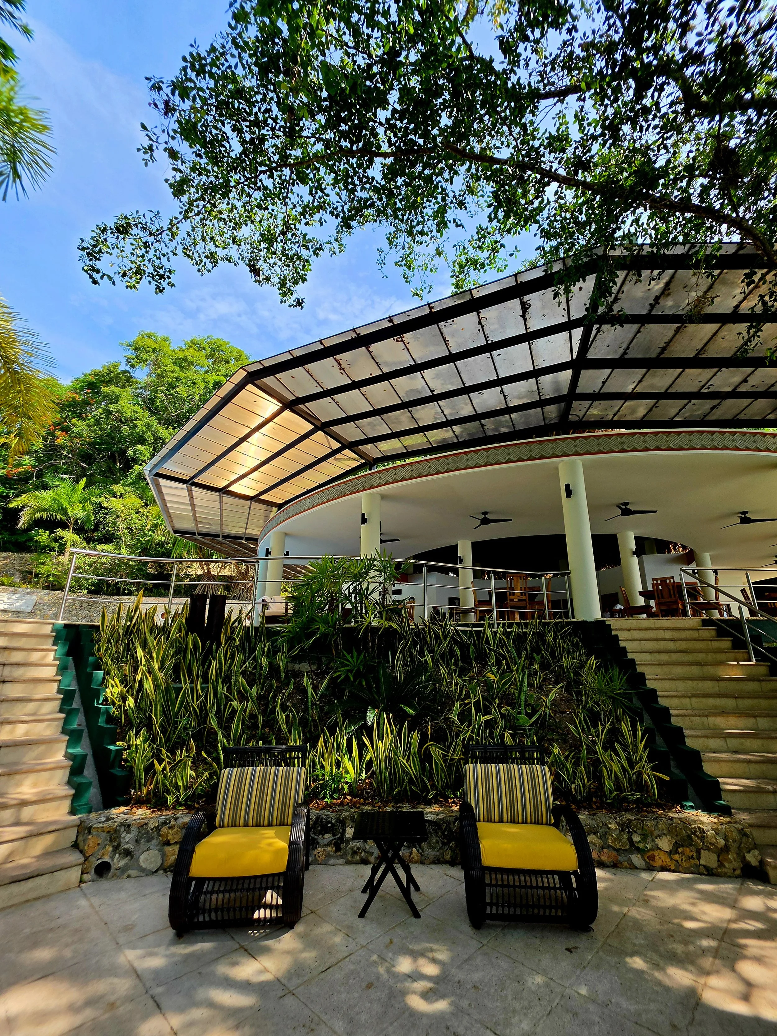 Elegant open-air lounge surrounded by tropical gardens