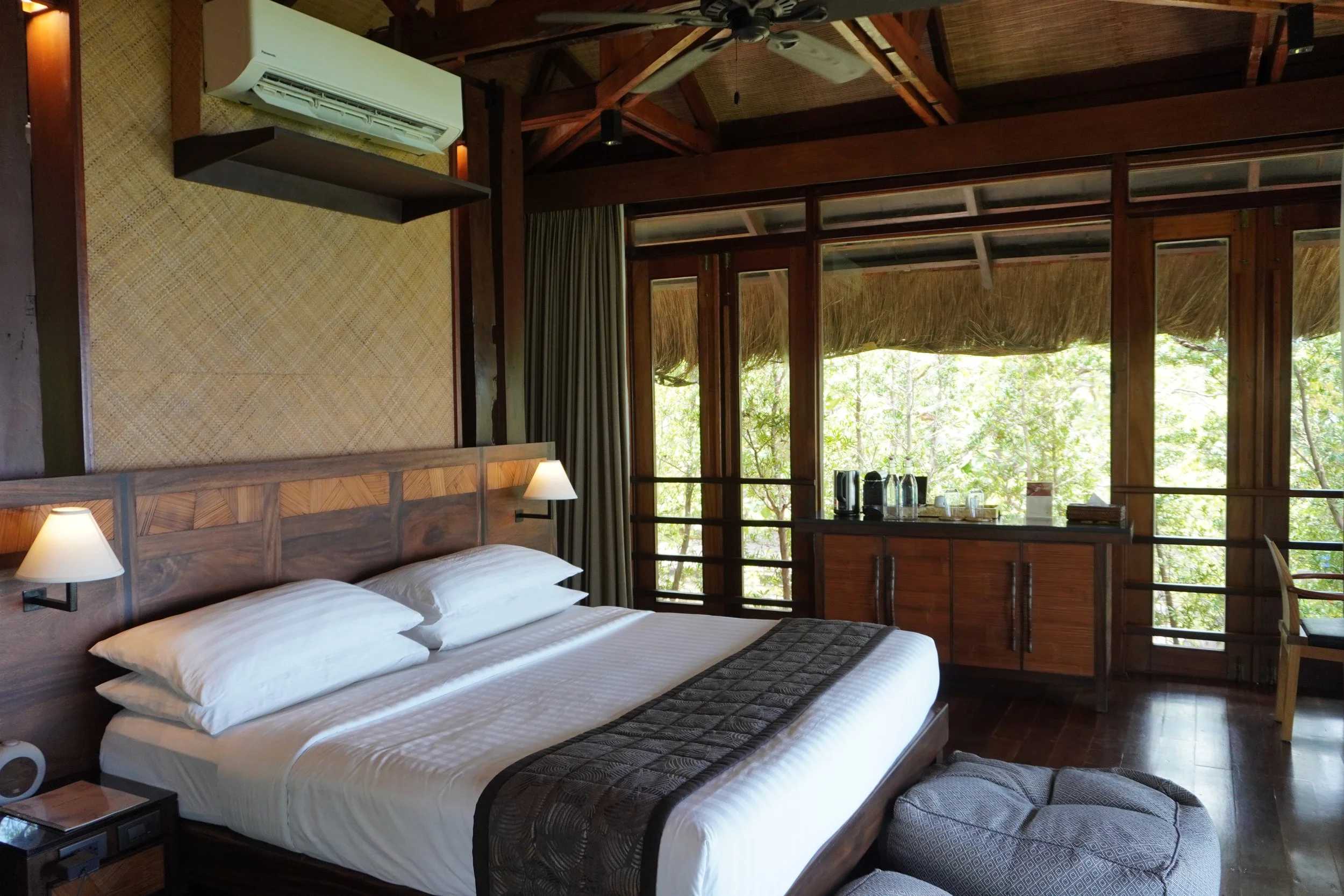 Spacious luxury villa with warm wood interiors and tropical garden views