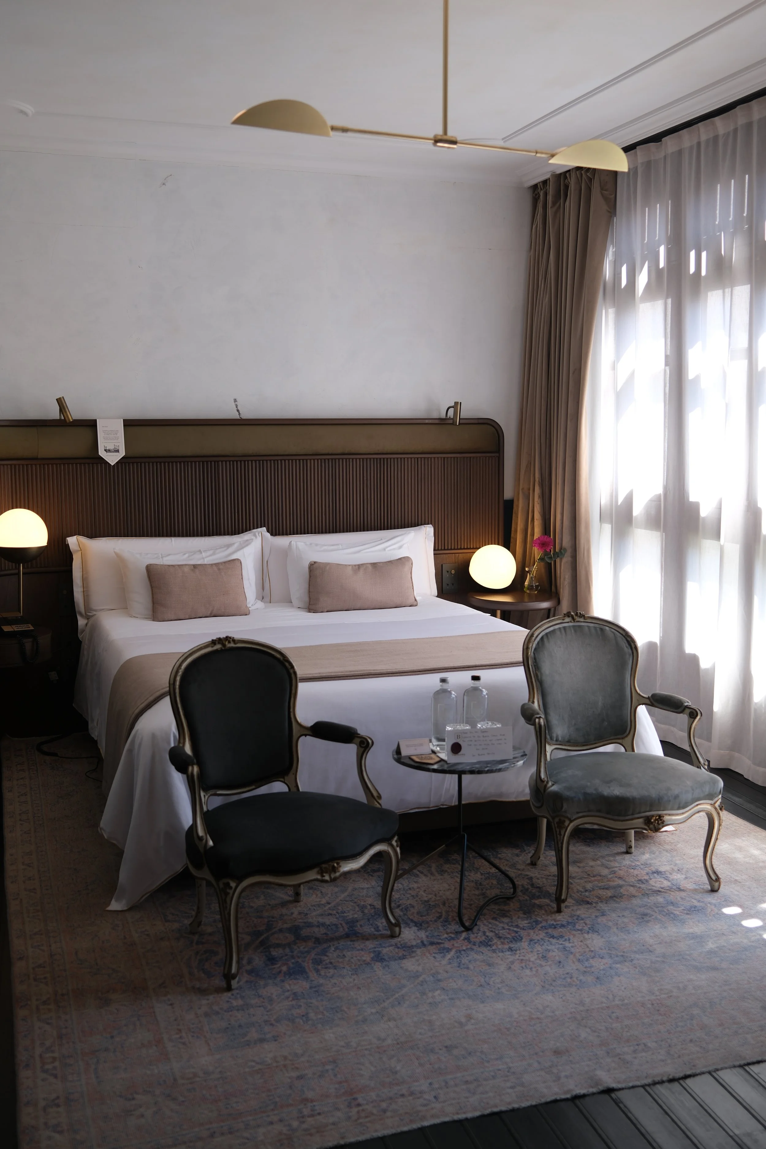 Elegant suite interior with vintage seating at Can Bordoy Grand House & Garden in Palma de Mallorca