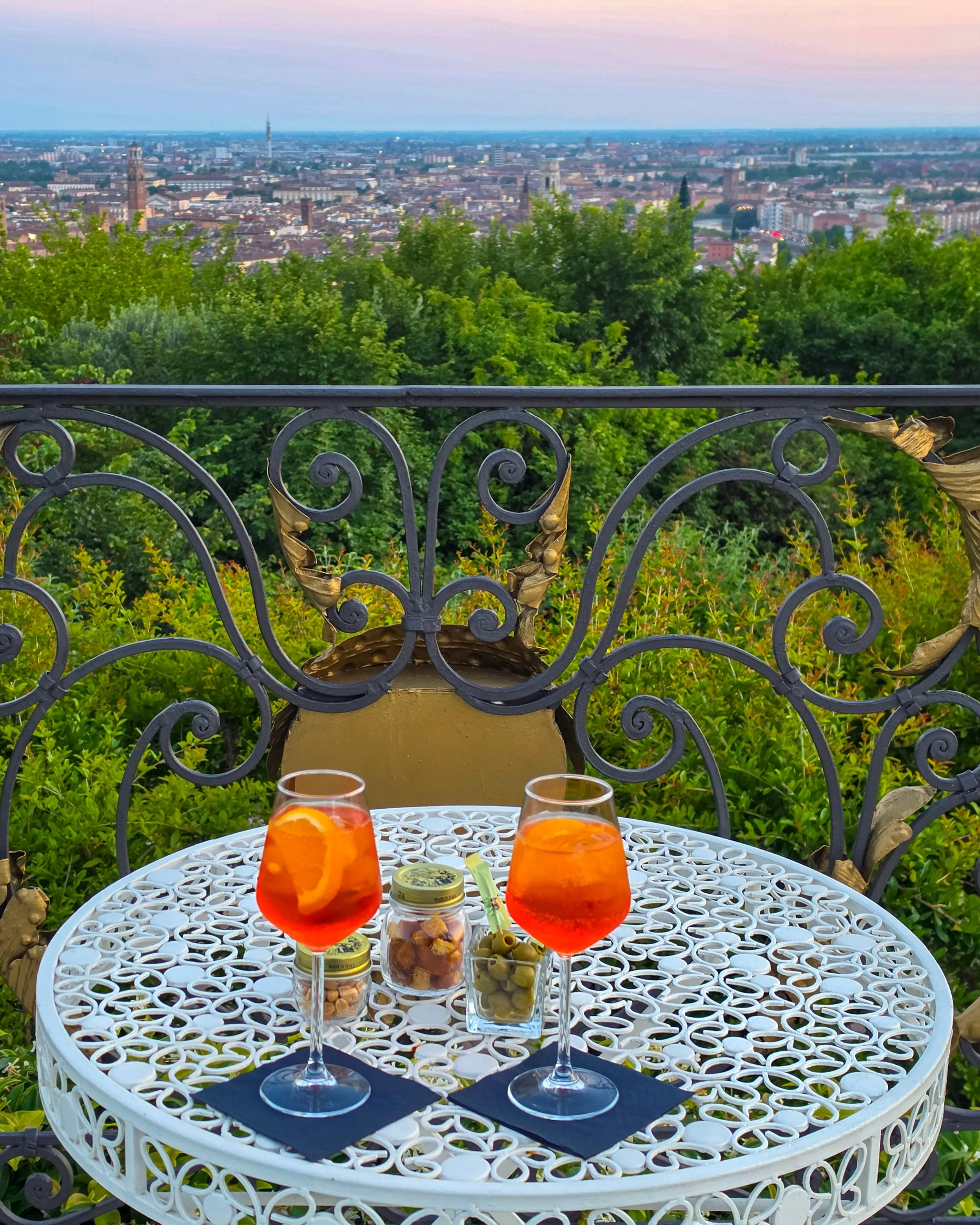 Aperitivo overlooking Verona with classic Italian cocktails and panoramic city views at sunset