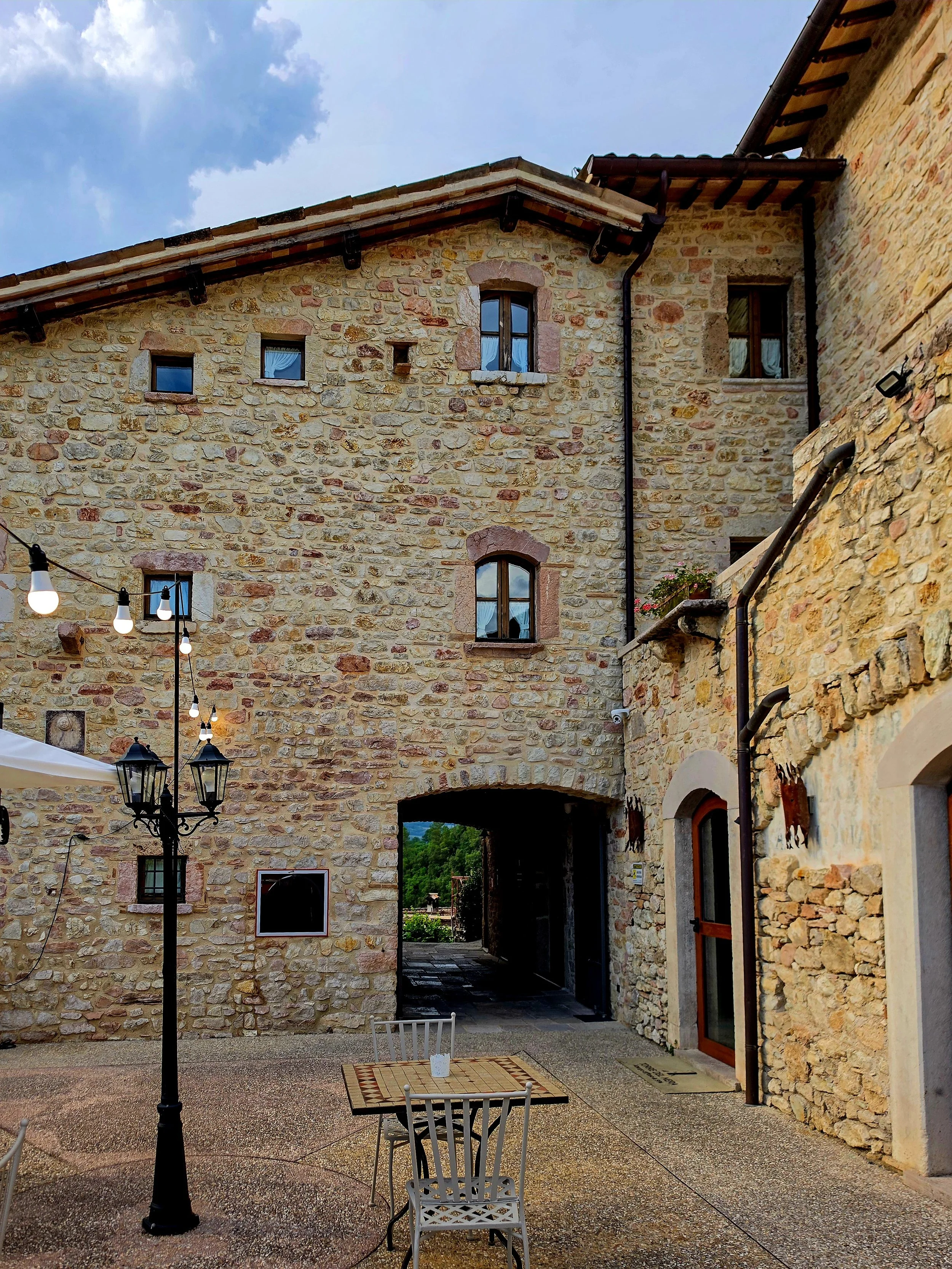 Charming courtyard framed by centuries old architecture and traditional lanterns