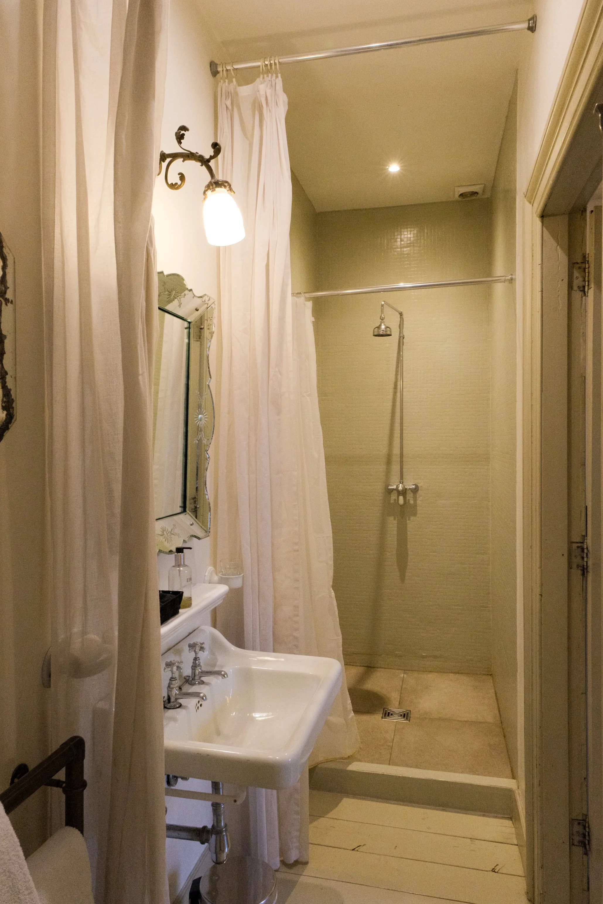 Classic bathroom featuring walk-in rainfall shower and vintage details