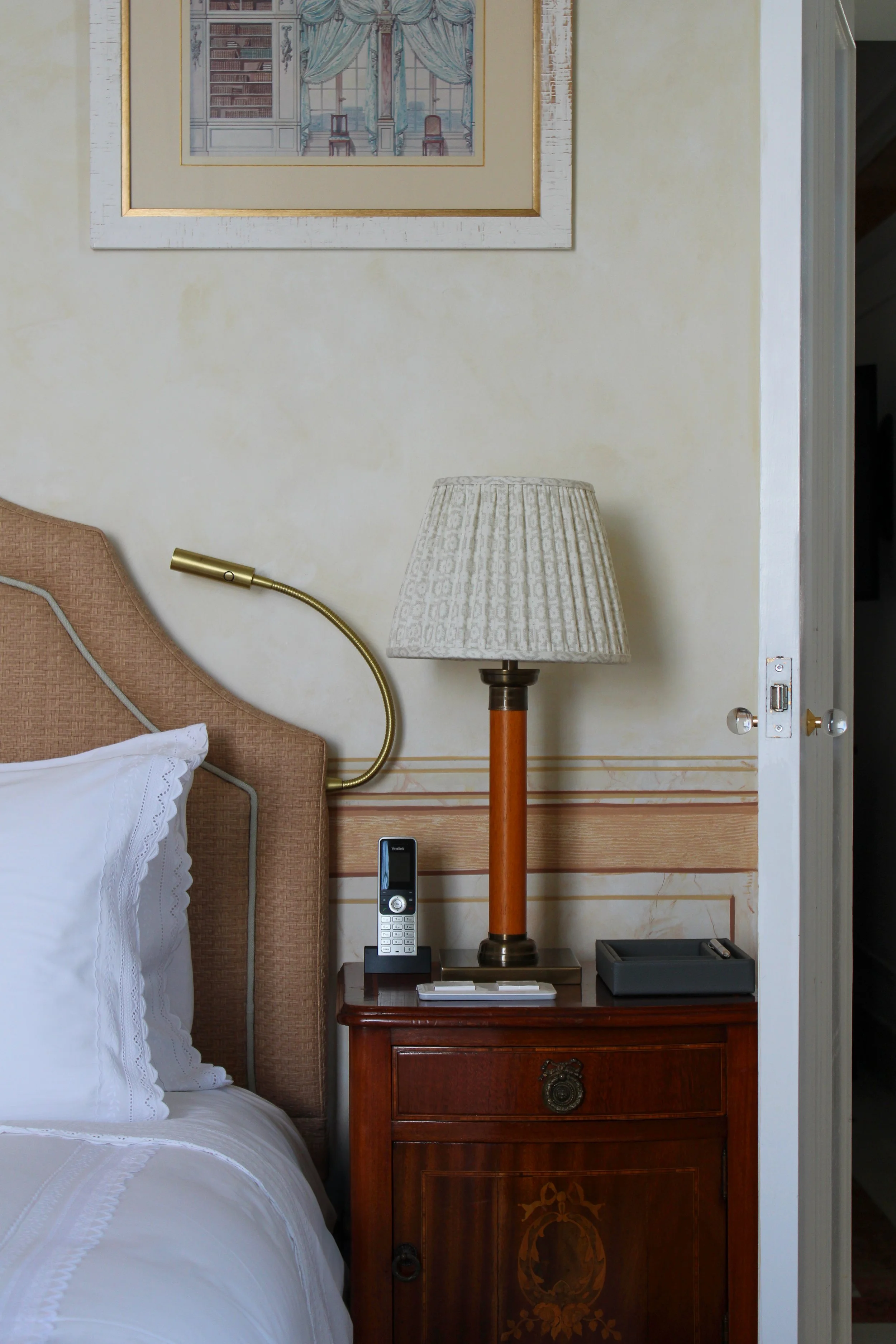 Classic furnishings and handcrafted details bring timeless elegance to the guest room