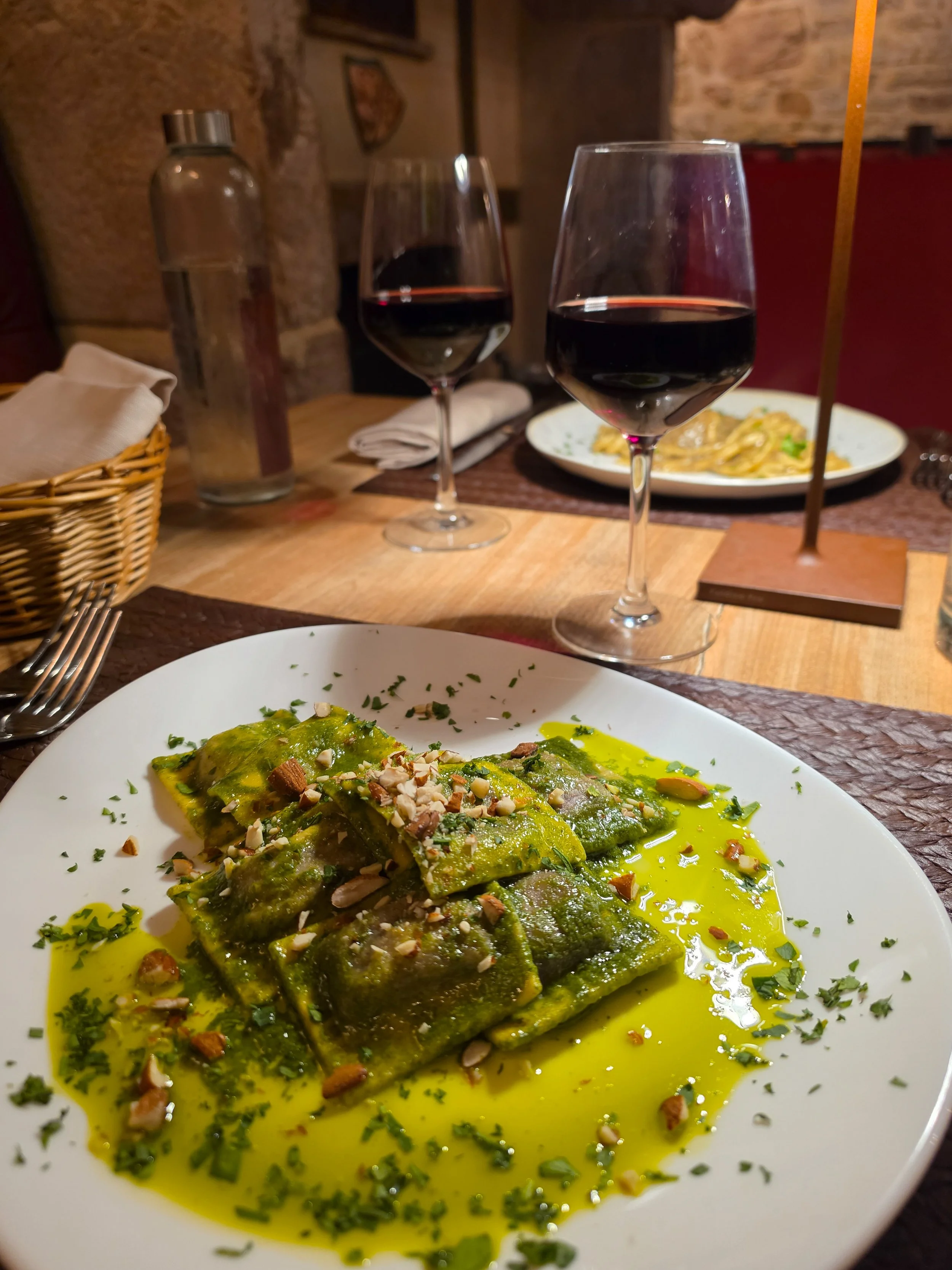 Homemade ravioli served with aromatic herbs and extra virgin olive oil