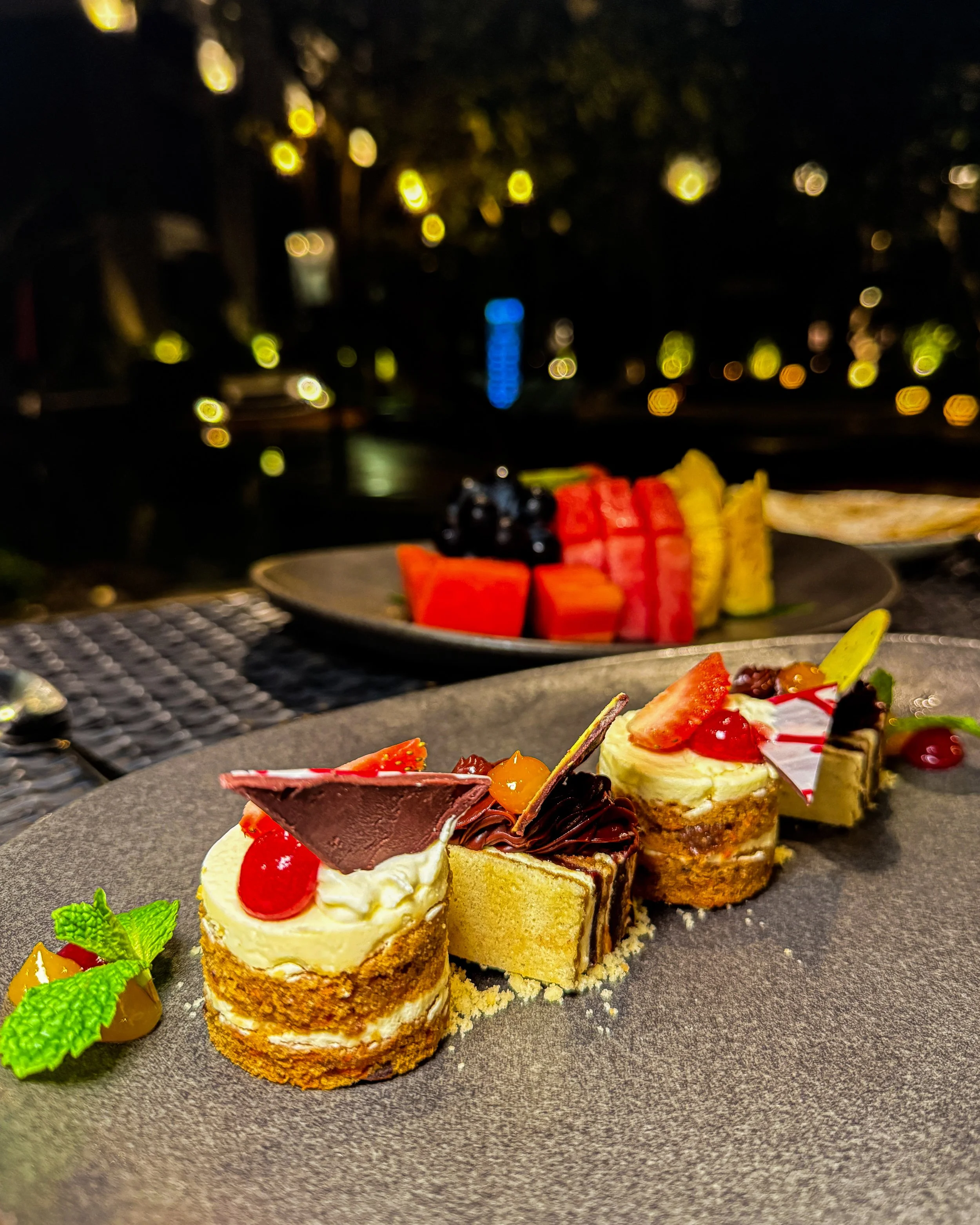 An assortment of handcrafted desserts and fresh fruit brings a refined finish to an evening dining experience