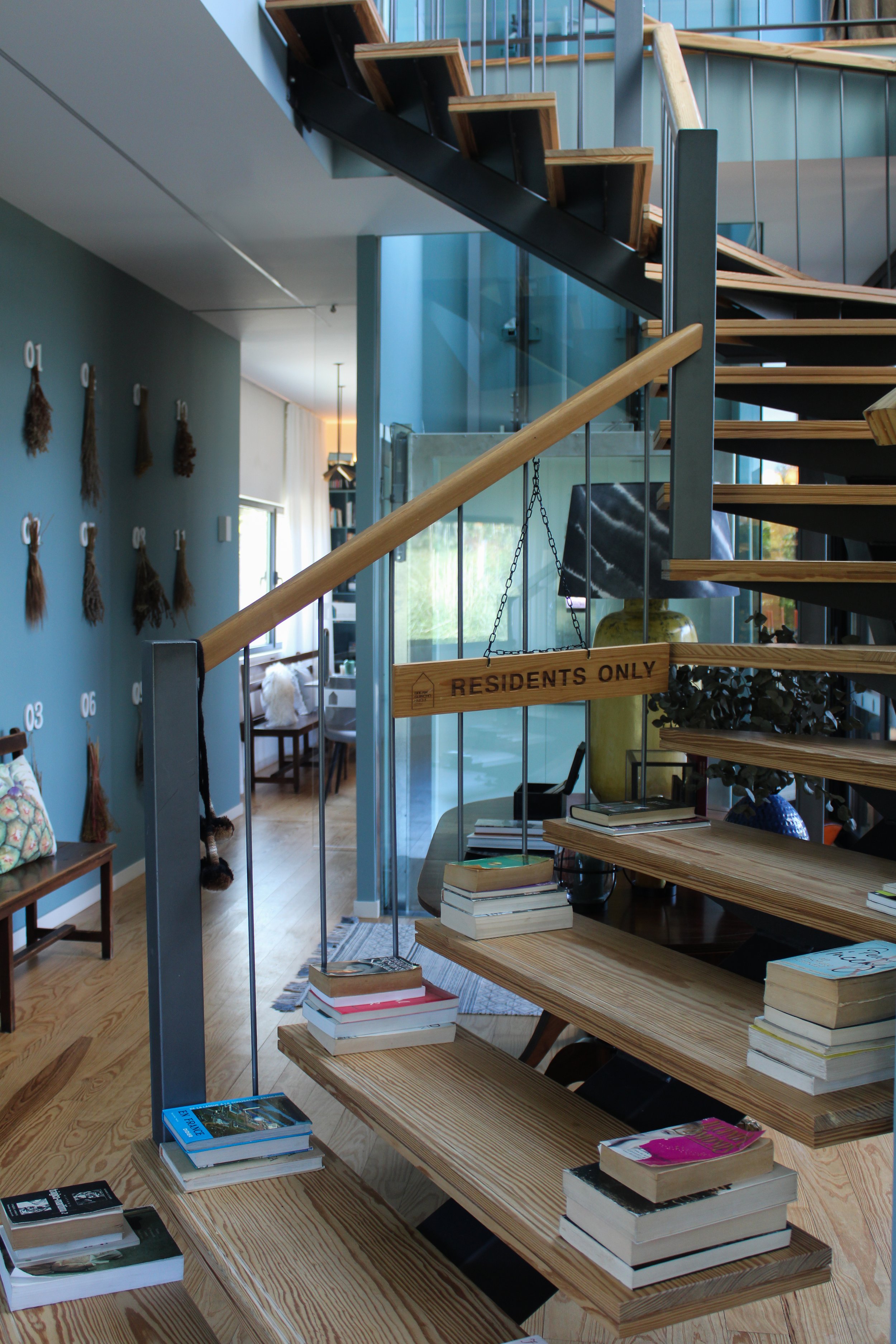 Modern boutique hotel staircase with open wooden steps and contemporary architectural design