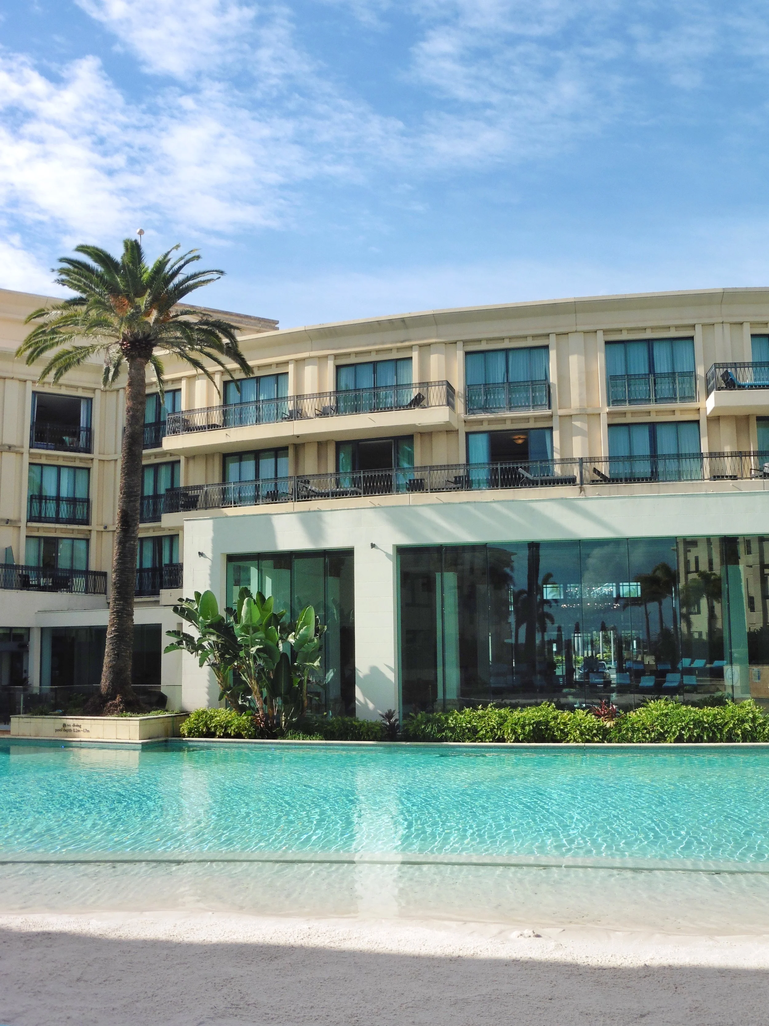 Crystal-clear lagoon pool with private cabanas at Imperial Hotel Gold Coast