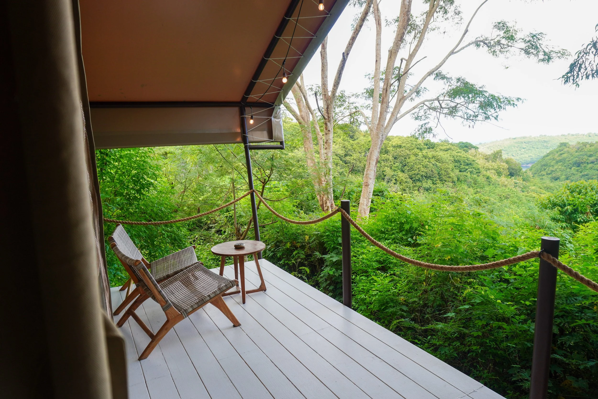 Private terrace overlooking dense greenery, a quiet moment suspended between comfort and wilderness, Autentik Penida – Nusa Penida, Bali.
