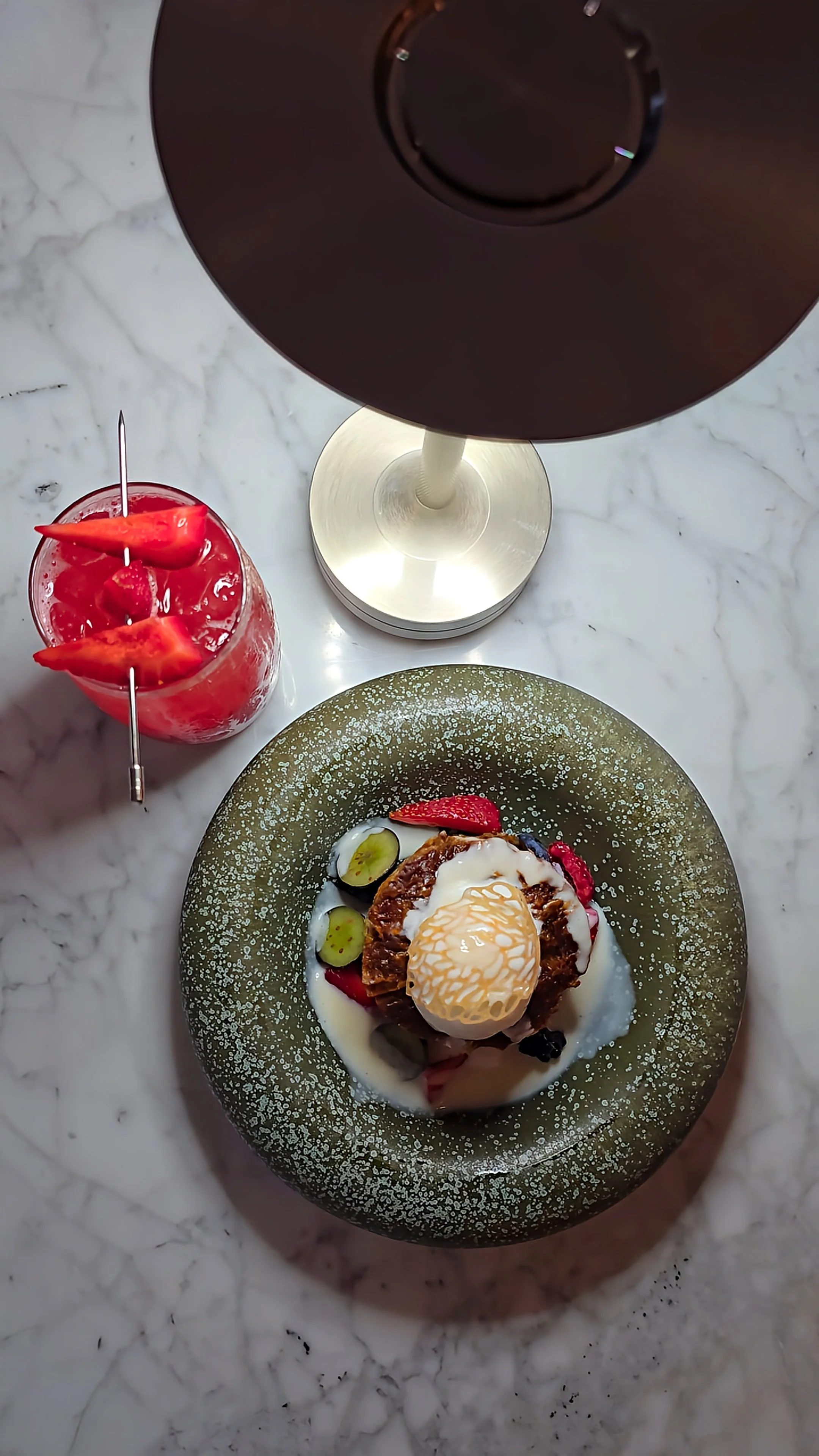 Elegant dessert presentation paired with a handcrafted cocktail at JW Marriott Hotel Tashkent’s signature restaurant