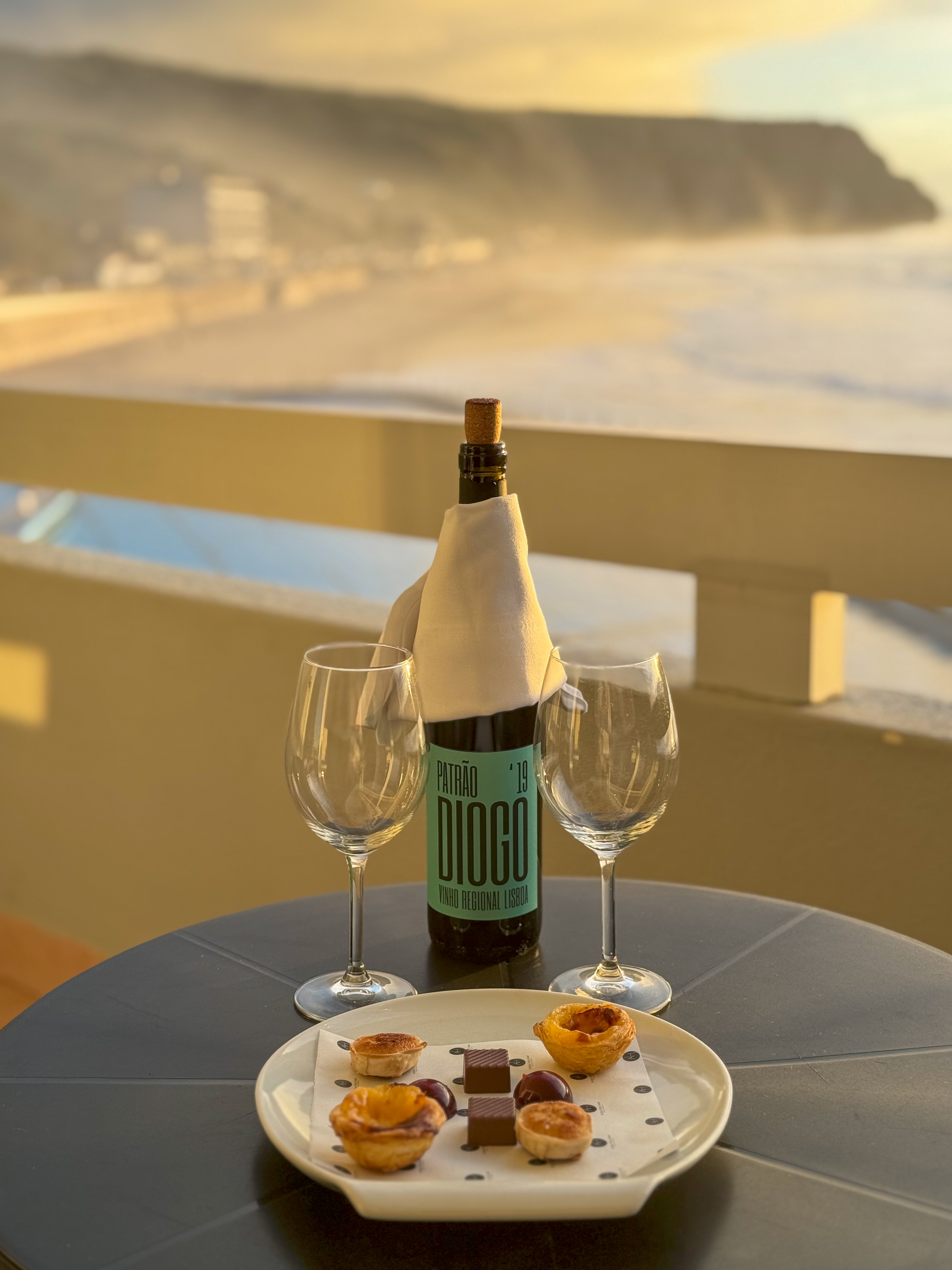 Welcome wine, Portuguese pastries, and ocean views from a private balcony at Arribas Hotel
