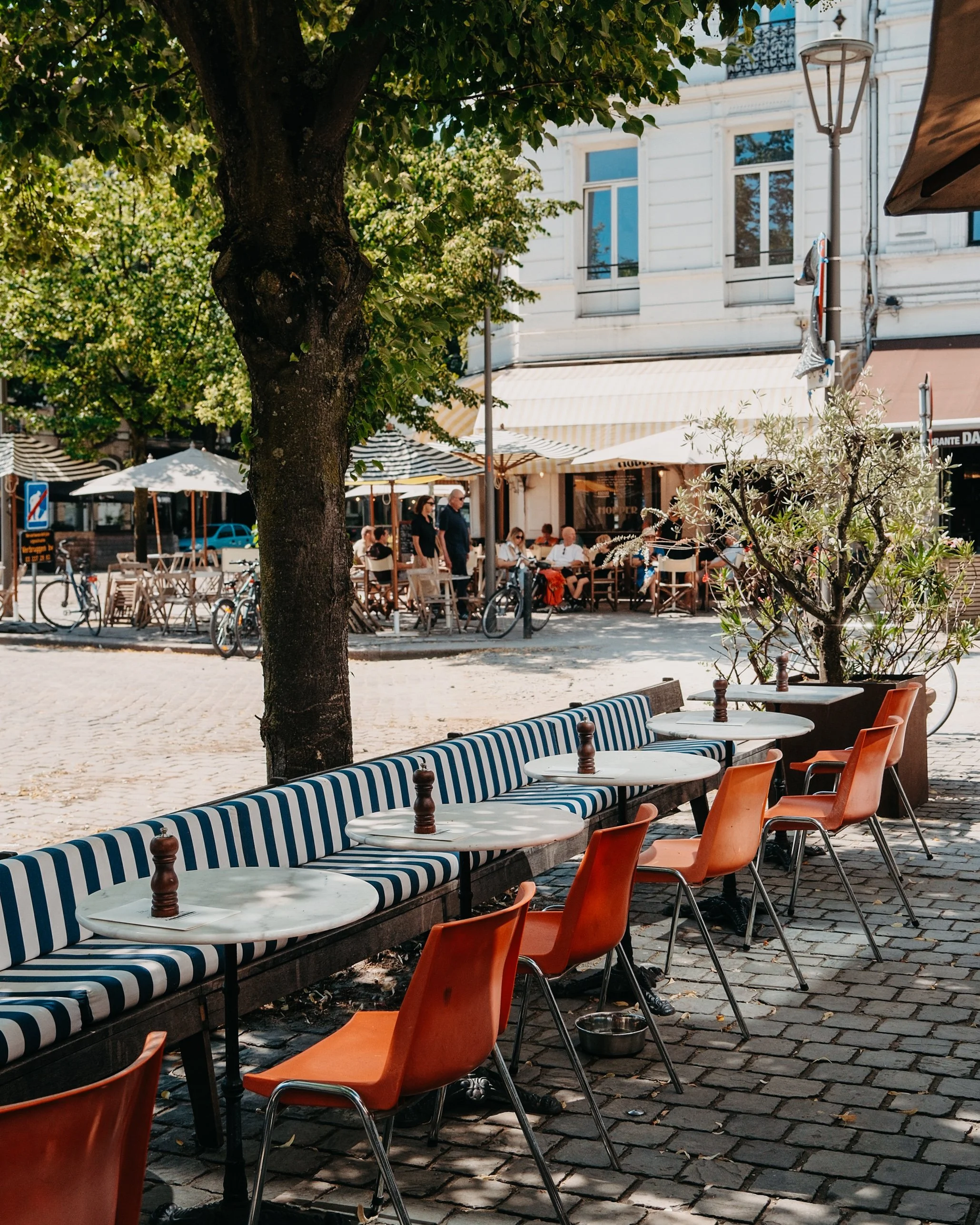 Sunny terrace overlooking one of Antwerp's lively neighbourhood squares