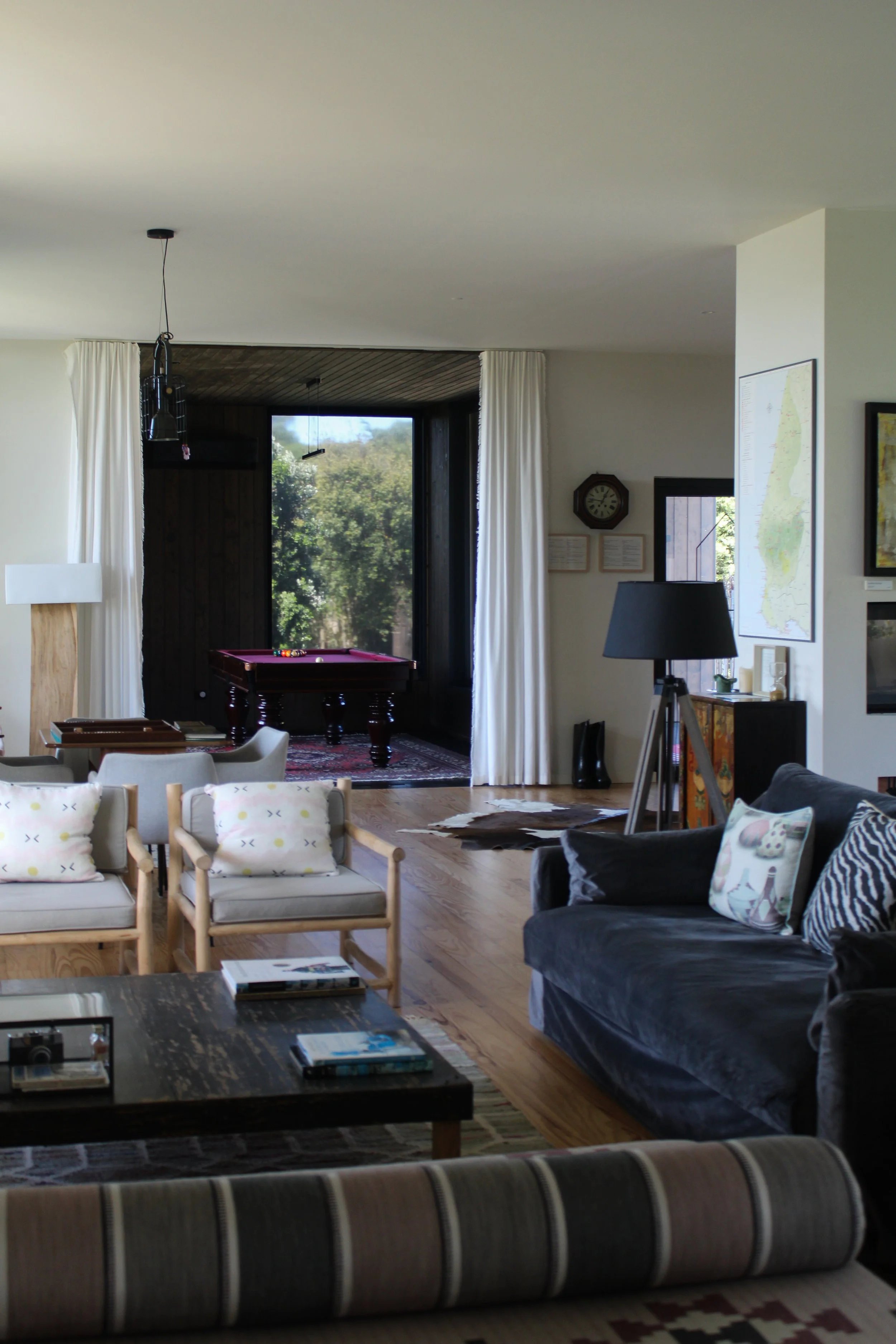 Spacious living area with curated design, natural light, and cozy atmosphere at Dream Guincho