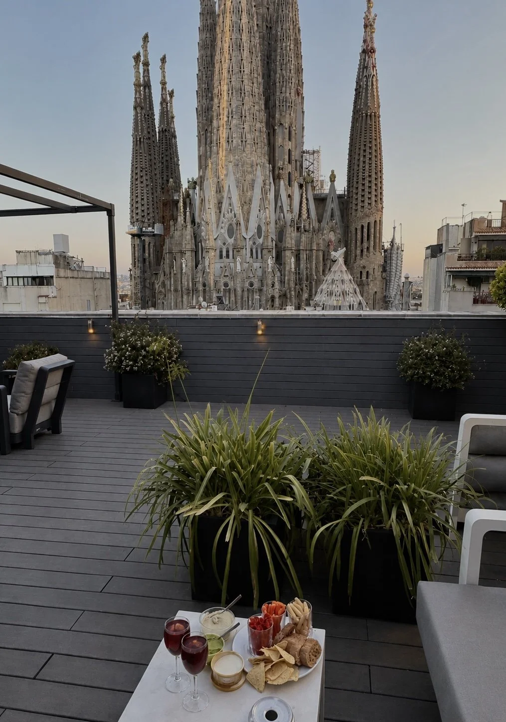 Rooftop terrace overlooking the iconic Sagrada Família at sunset