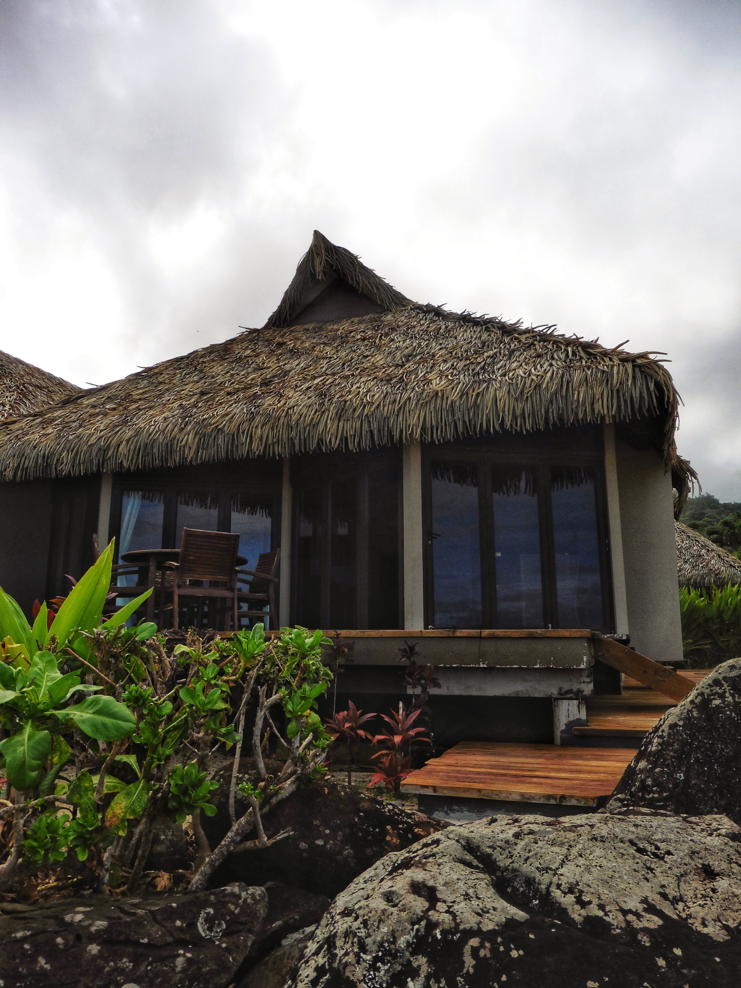 Traditional beachfront villa with authentic thatched roofing and direct access to the shoreline
