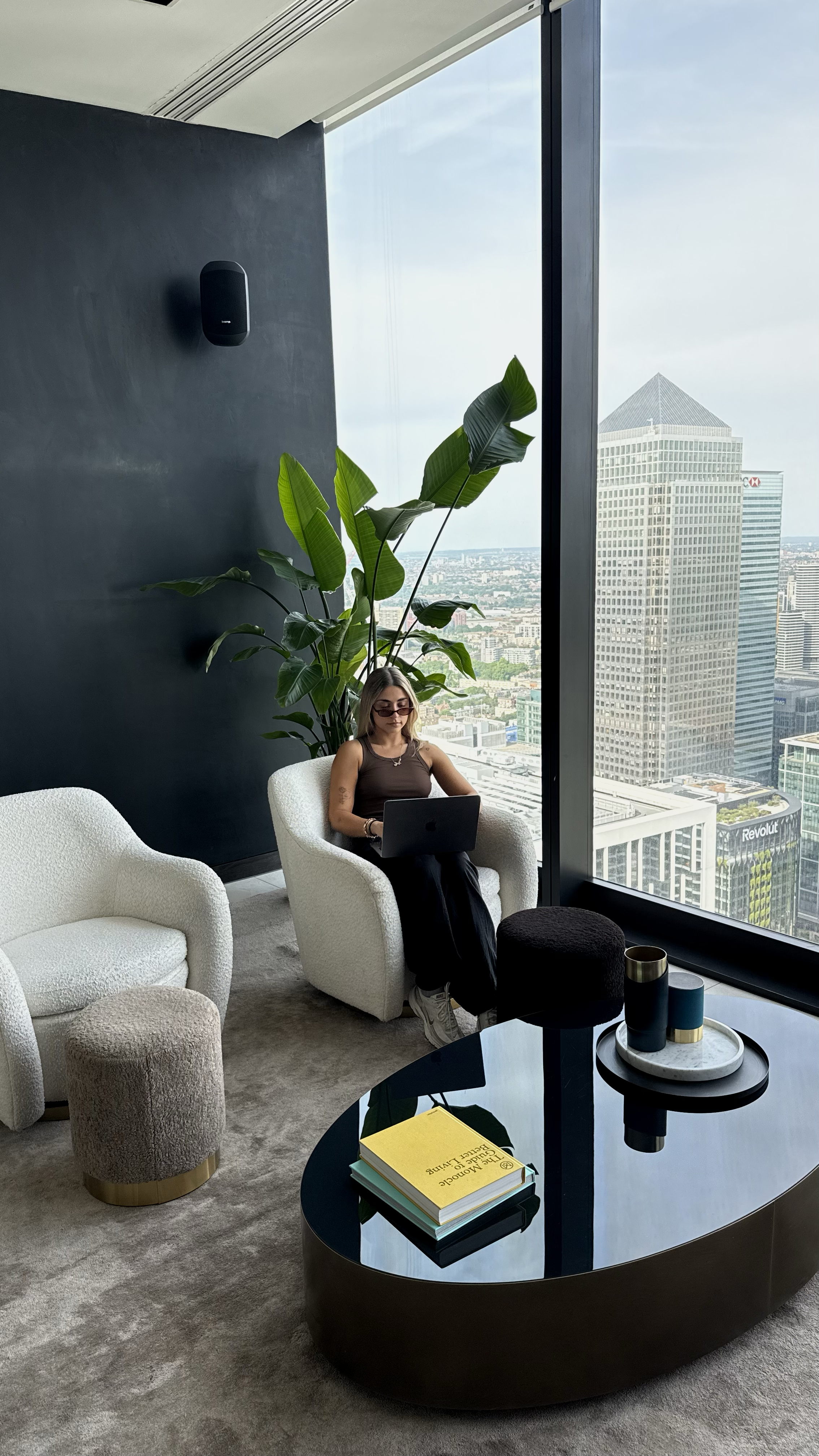 Comfortable workspace with floor-to-ceiling windows overlooking London’s skyline