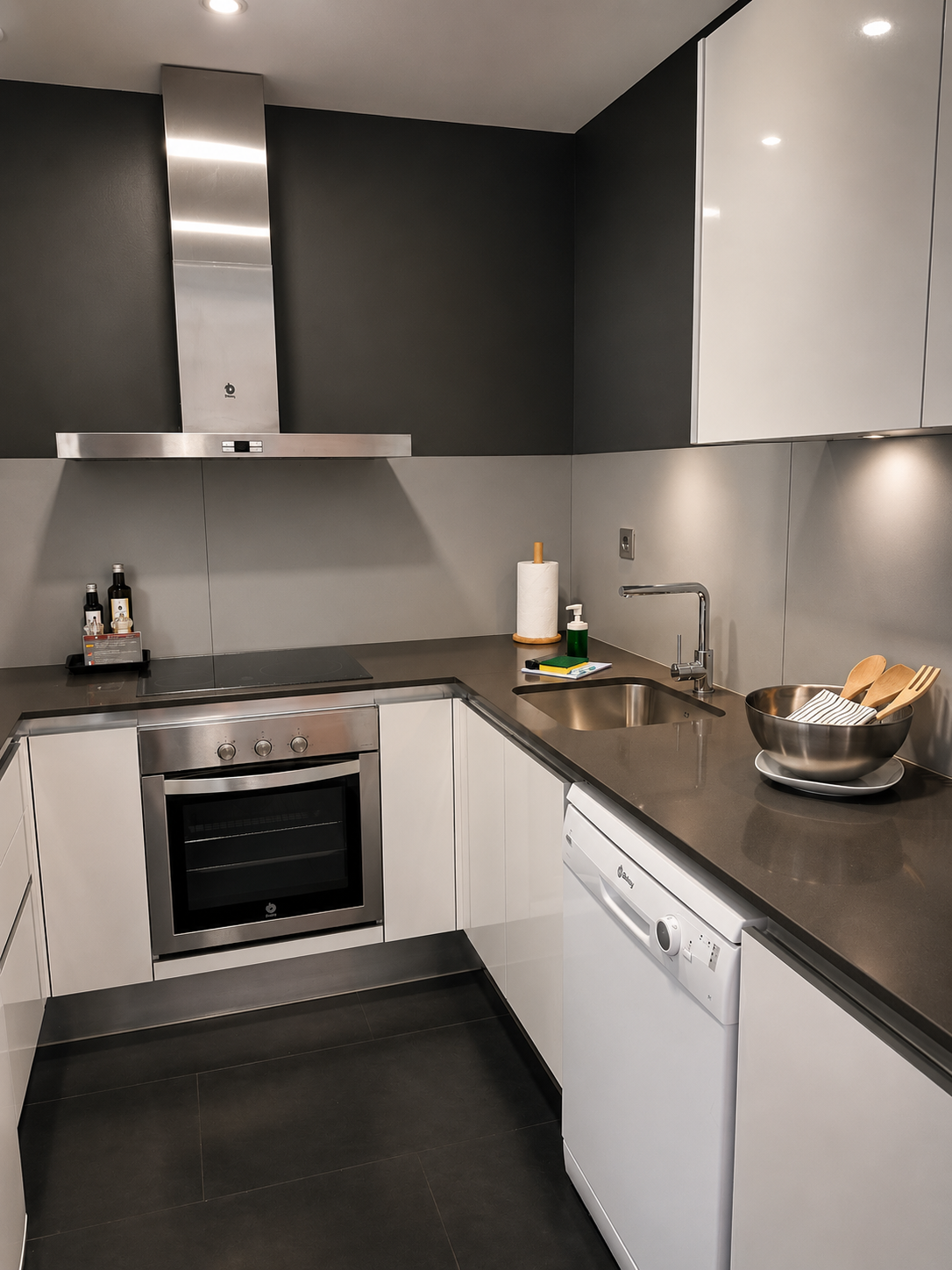Modern fully equipped apartment kitchen with sleek contemporary finishes