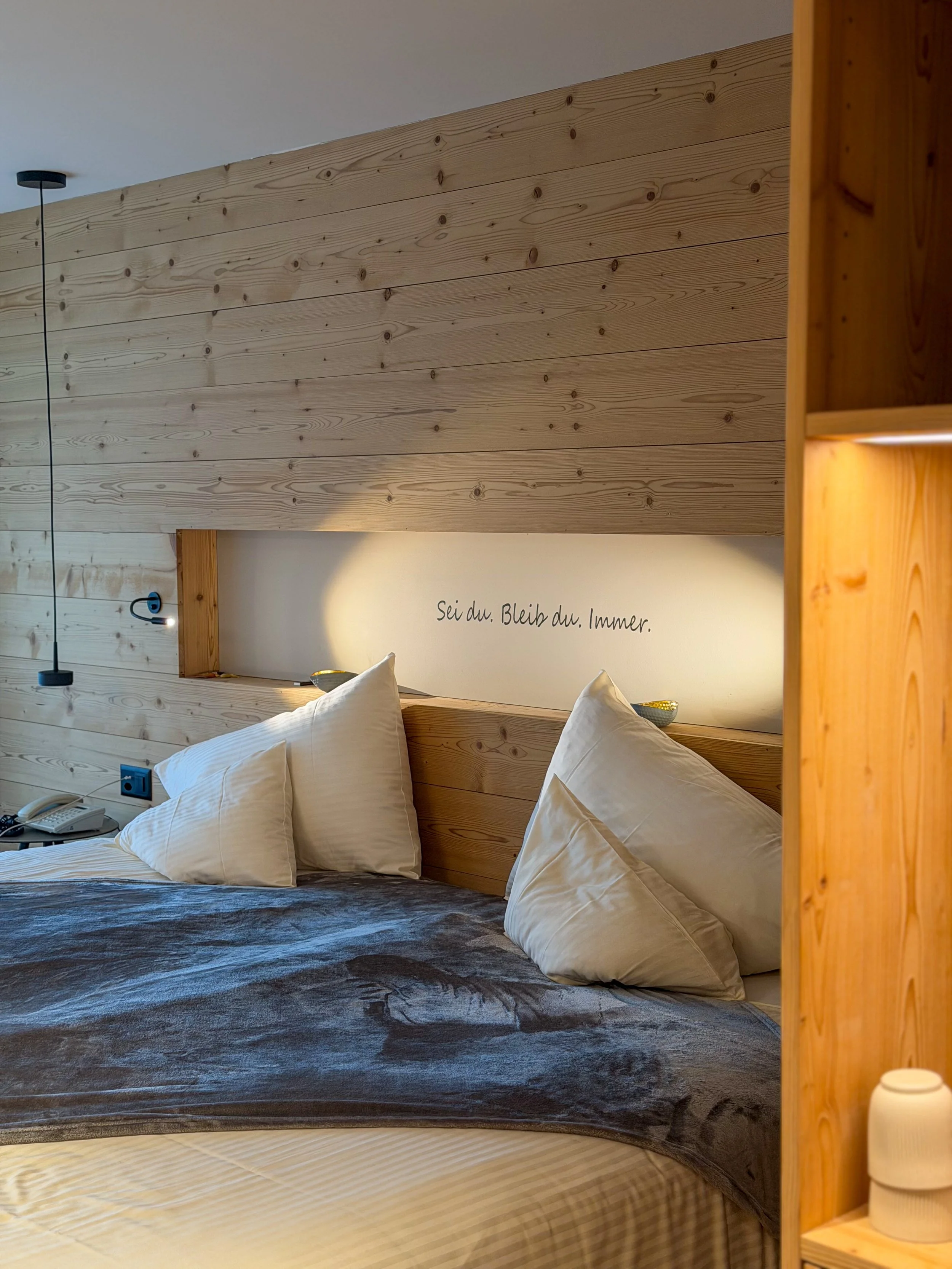 Contemporary mountain-inspired bedroom with handcrafted wood details and calming alpine ambiance at Eiger Mountain & Spa Soul Resort