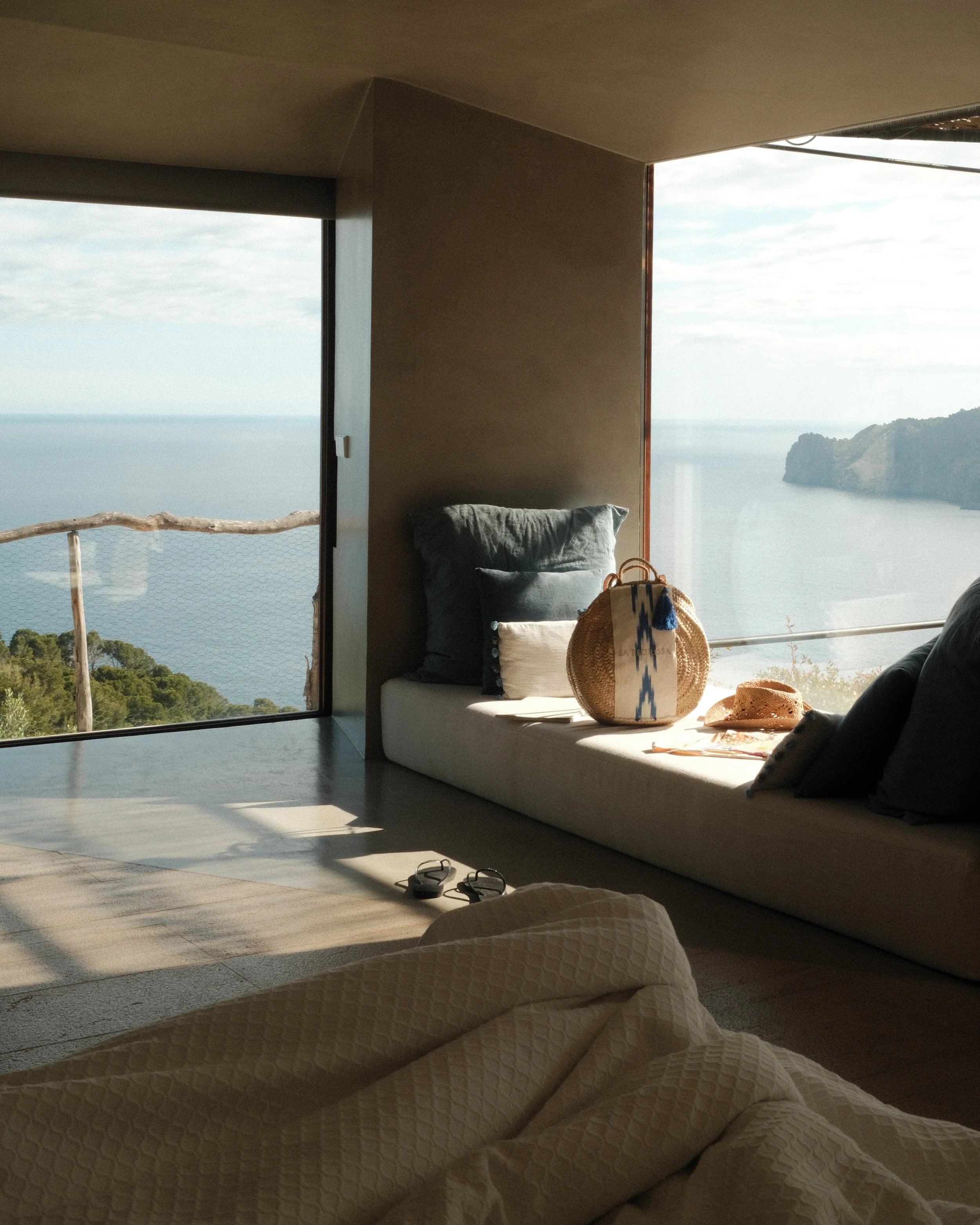 Panoramic sea-view suite with floor-to-ceiling windows overlooking the Mediterranean coastline at Sa Pedrissa, Mallorca