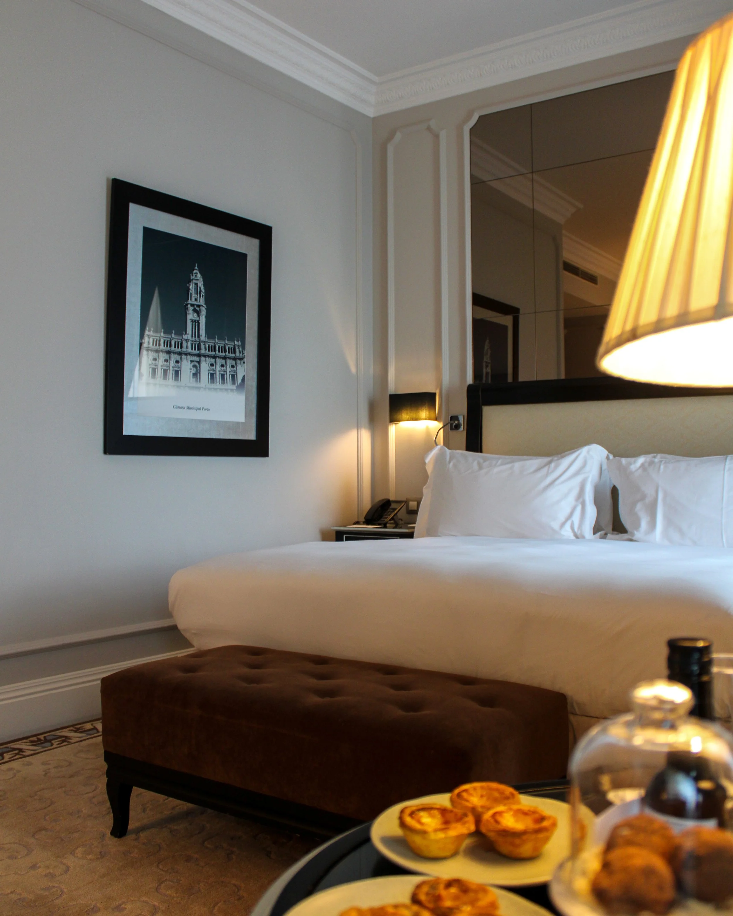 Luxury guest room with king bed, refined décor, and welcome treats