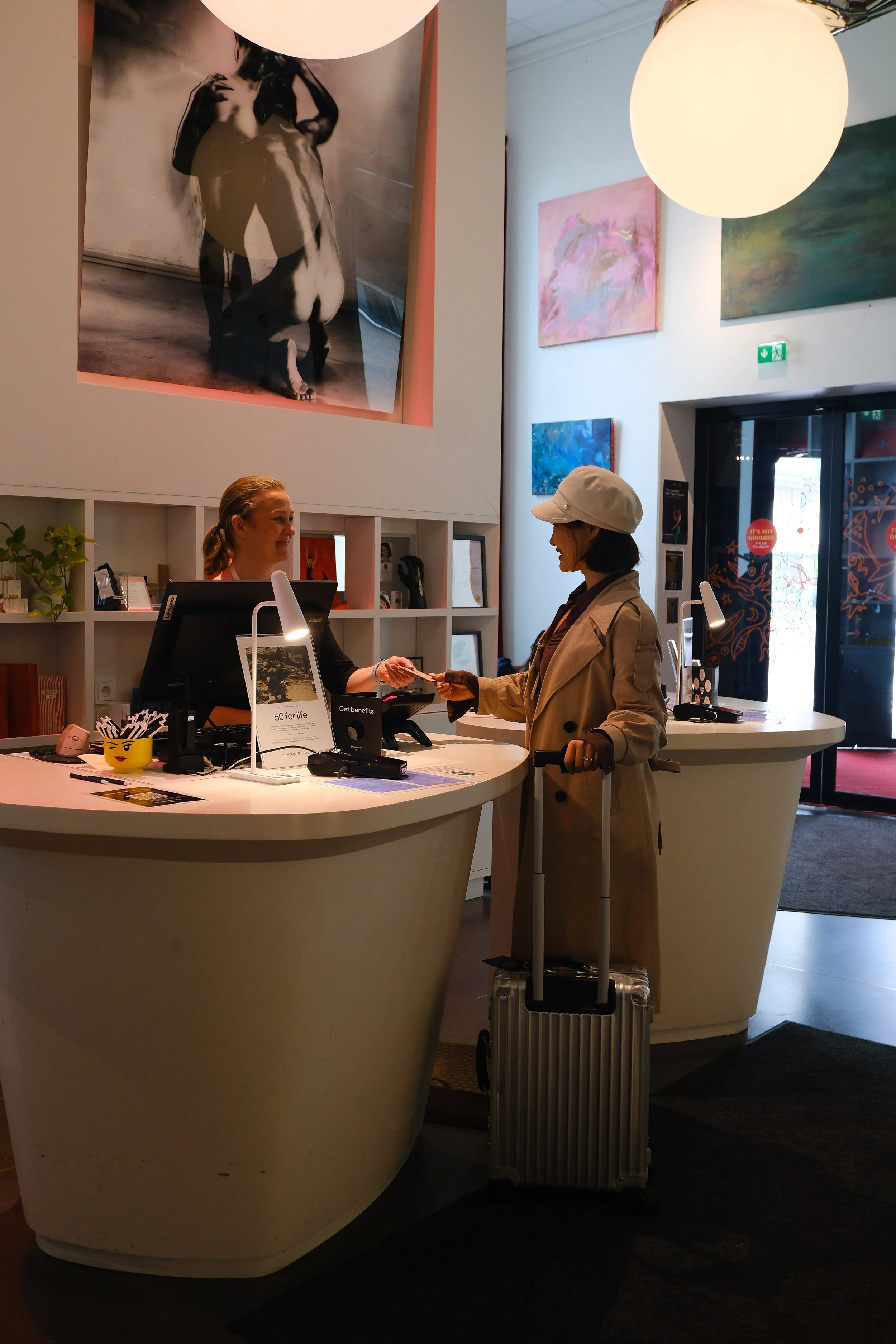 Guest checking in at the creative reception with modern artistic interiors
