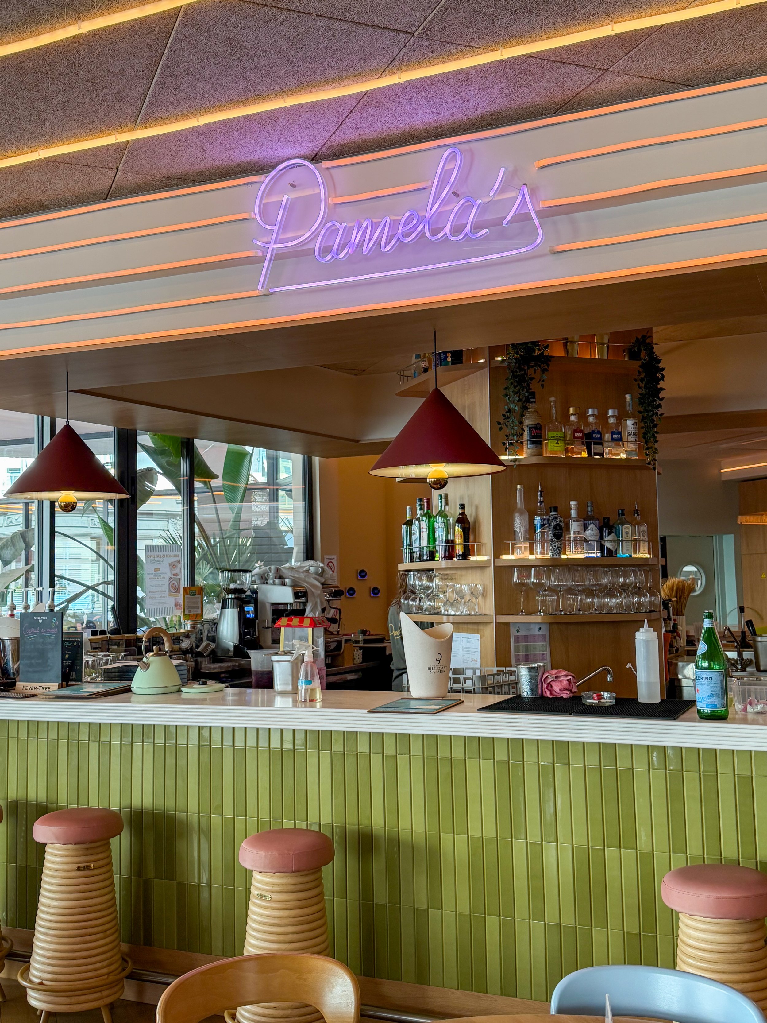 Stylish cocktail bar serving signature drinks in a vibrant social atmosphere