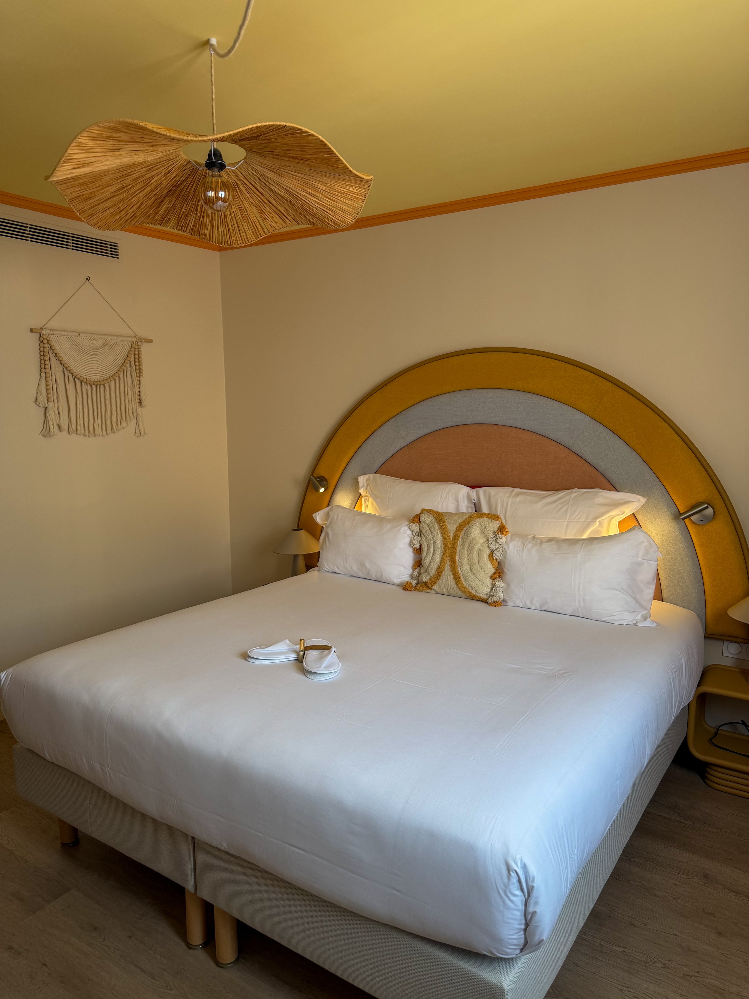Contemporary guest room blending comfort with colourful Riviera inspired design