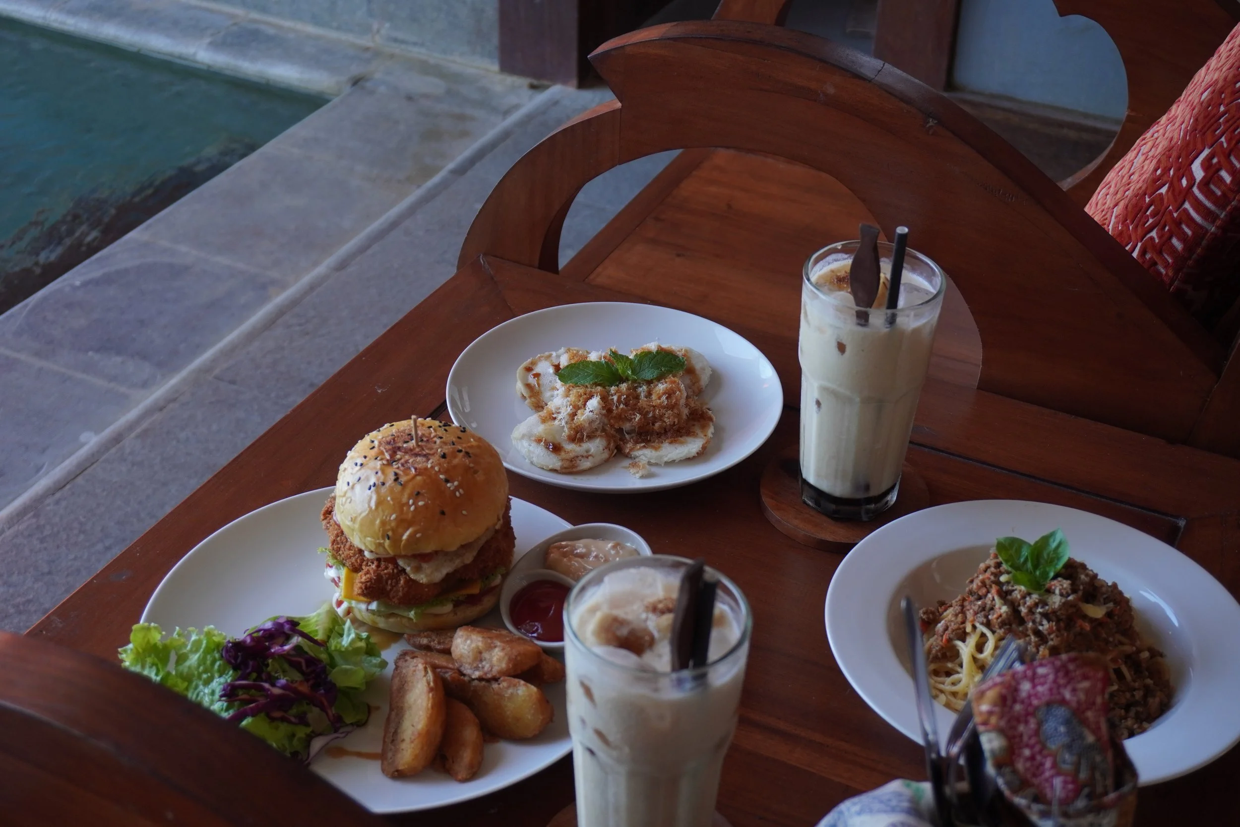Poolside lunch featuring gourmet dishes, desserts and refreshing iced coffees