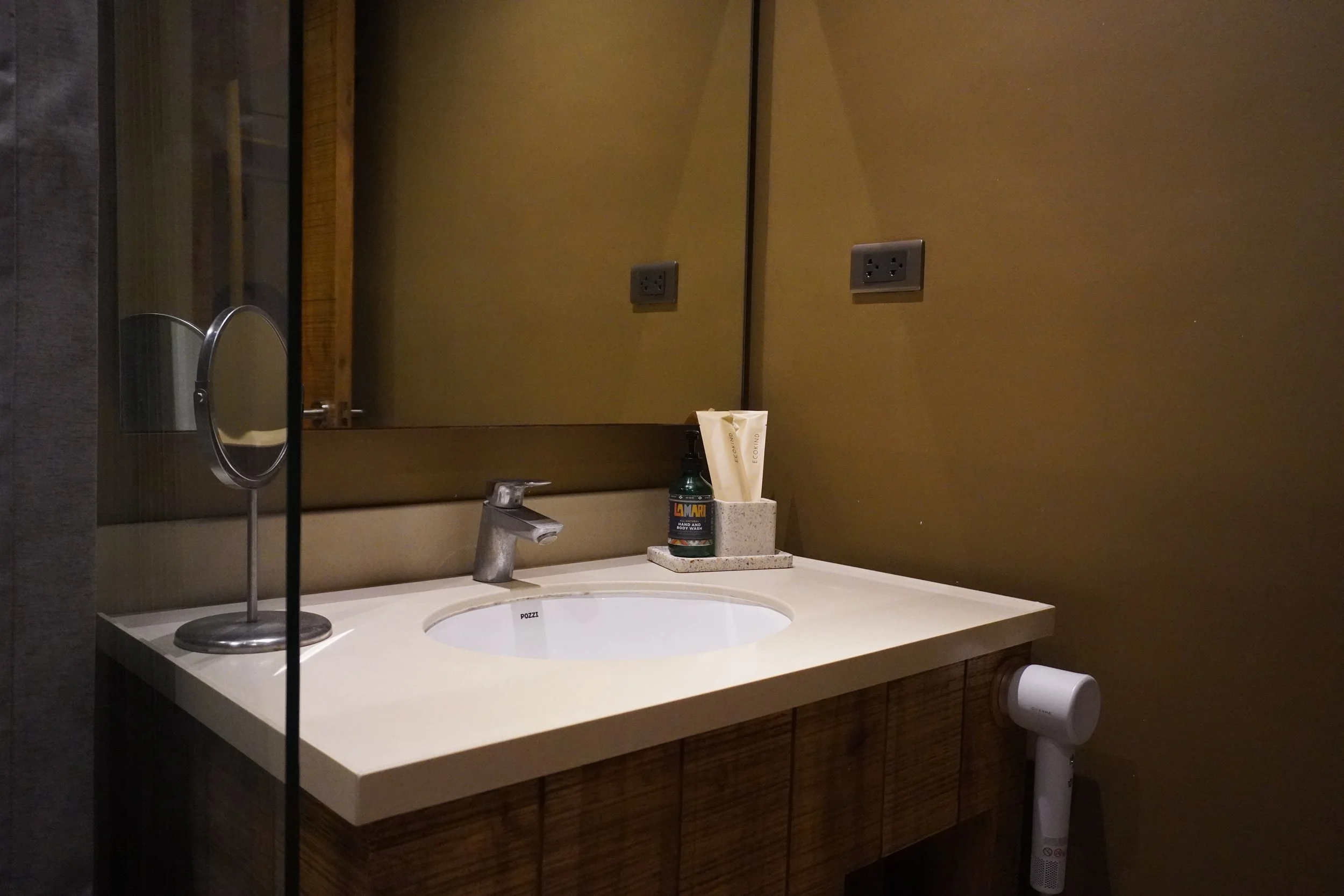 Modern bathroom with premium amenities and warm contemporary design