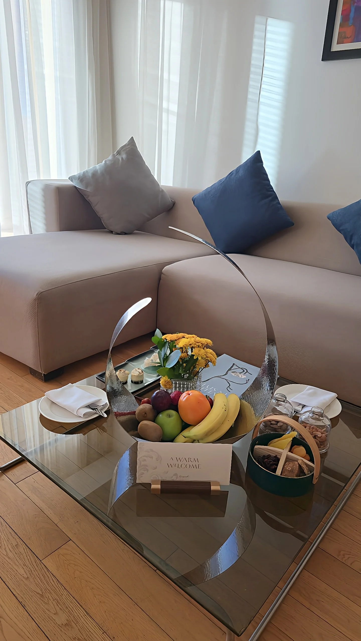 Luxury suite welcome amenities featuring fresh fruit, local treats, and elegant living space