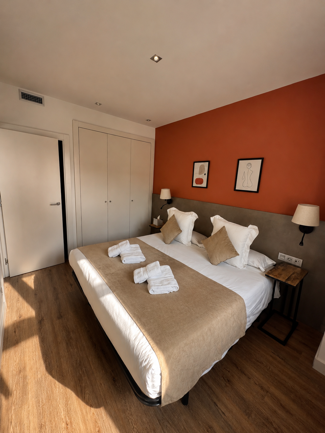 Bright bedroom with warm contemporary design and king size bed